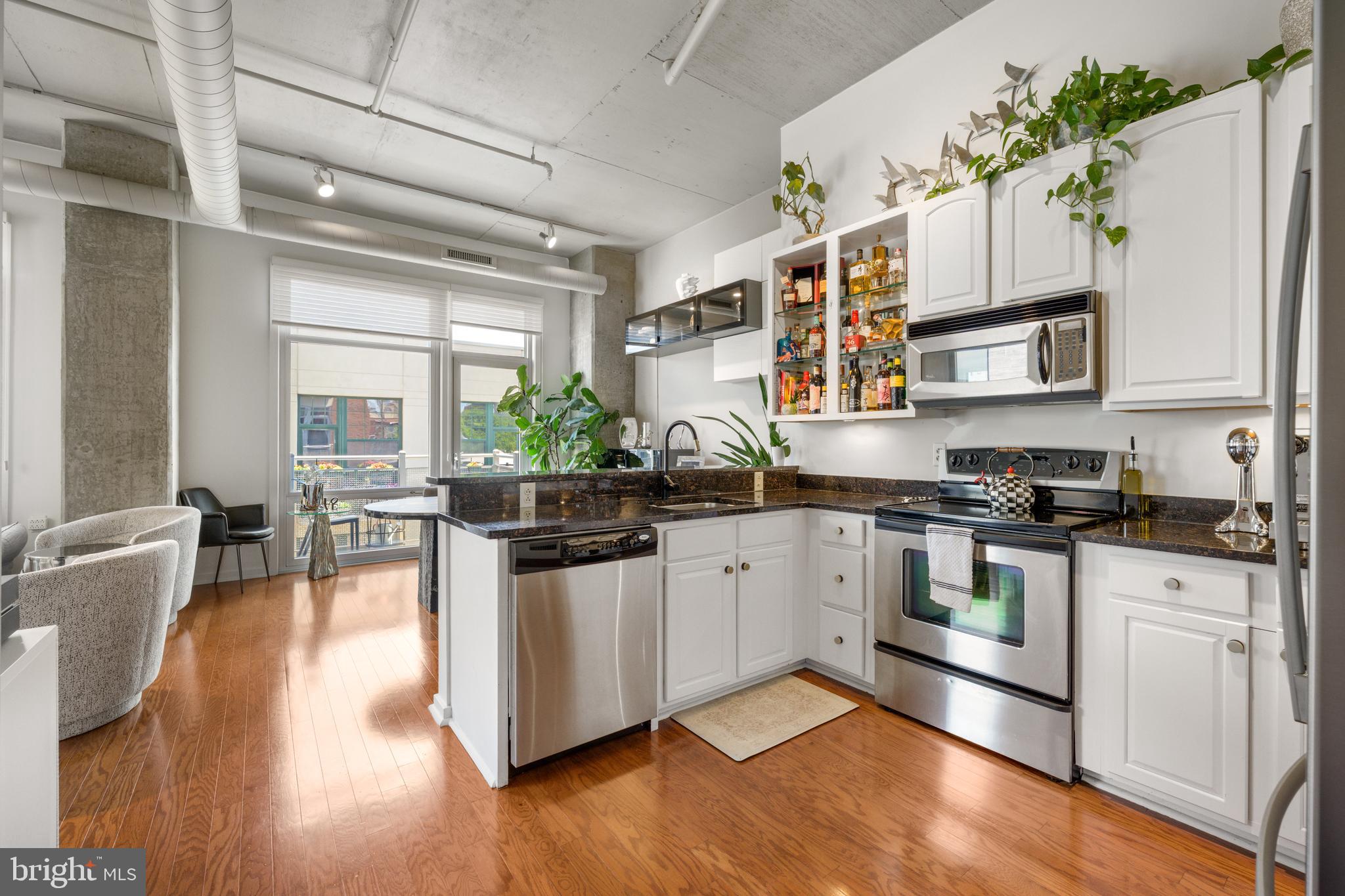 Perfectly positioned at 113 N Bread Street in the heart of historic Old City Philadelphia, this exceptional 3-bedroom, 2-bath residence within the highly sought-after National Condominiums offers the perfect blend of luxury, character, privacy, and convenience in one of the city’s most vibrant and walkable neighborhoods. From the moment you enter, you are welcomed by soaring ceilings, oversized windows, and an abundance of natural light that fills the expansive open-concept living spaces. The thoughtfully designed layout creates a bright and sophisticated atmosphere ideal for both everyday living and entertaining. The spacious primary suite serves as a private retreat featuring a beautifully appointed en-suite bathroom and generous closet space. Two additional bedrooms provide flexibility for guests, a home office, or growing families. Step outside onto your private balcony — the perfect setting to enjoy your morning coffee or unwind in the evening while overlooking the charm and energy of Old City. This beautifully maintained home has been extensively upgraded with stylish modern enhancements, including designer tiled accent walls, renovated kitchen cabinetry with upgraded hardware and LED lighting, newer premium appliances and refrigerator, updated bathroom fixtures, decorative office paneling, and painted and sealed exposed ductwork that creates a sophisticated industrial loft aesthetic. Deep closets and abundant storage throughout complete the home’s thoughtful design. Residents of National Condominiums enjoy an elevated lifestyle with premium amenities including secure gated entry, deeded parking, concierge service, a private mail room, and beautifully landscaped courtyard and social gathering spaces. Location is everything — and this home delivers. Situated directly across from the iconic Elfreth’s Alley and moments from Philadelphia’s finest restaurants, cafés, boutiques, waterfront attractions, and historic landmarks, you are truly at the center of it all. Enjoy effortless access to I-95, the Benjamin Franklin Bridge, Center City, and renowned institutions including the University of Pennsylvania, Drexel University, Thomas Jefferson University Hospital, and Children's Hospital of Philadelphia. A rare opportunity to own a truly distinctive residence in one of Philadelphia’s most iconic neighborhoods.