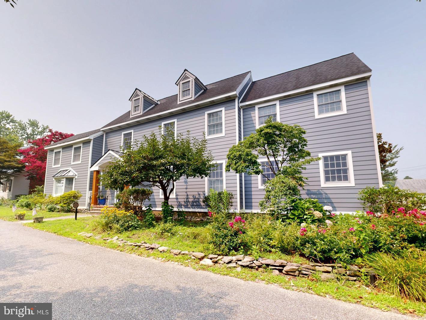 Located just one block from Oxford's scenic waterfront, 105 Jefferson Street offers a rare opportunity to own a beautifully updated home in the heart of historic Oxford, Maryland. With off-street parking, a detached two-car garage, and a finished studio apartment above the garage, and a dedicated home-office, this property combines the charm of one of the Eastern Shore's most beloved waterfront towns with the convenience and flexibility today's buyers are searching for.

Designed for entertaining, the floor plan features multiple gathering spaces, including a family room, formal living room, dedicated recreation/game room with a newly installed wood-burning fireplace, additional den, and a separate home office, making it ideal for hosting family and friends, working remotely, or accommodating multi-generational living.

The home offers four bedrooms and flows effortlessly to a private backyard retreat featuring a gunite swimming pool and expansive newly installed composite deck. Recent exterior improvements include premium composite siding, new composite exterior doors, and durable metal roofing on the bump-outs. A new gas range adds another thoughtful update to the home's well-appointed kitchen.

Whether you're searching for a full-time residence, second home, or Eastern Shore retreat, this exceptional Oxford property places you just moments from marinas, public waterfront parks, local restaurants, the Oxford Community Center, the Oxford Museum, and the iconic Oxford-Bellevue Ferry. Combining timeless coastal charm with modern updates, versatile living spaces, and outstanding outdoor amenities, 105 Jefferson Street is a place to gather, entertain, and enjoy the best of waterfront town living.
