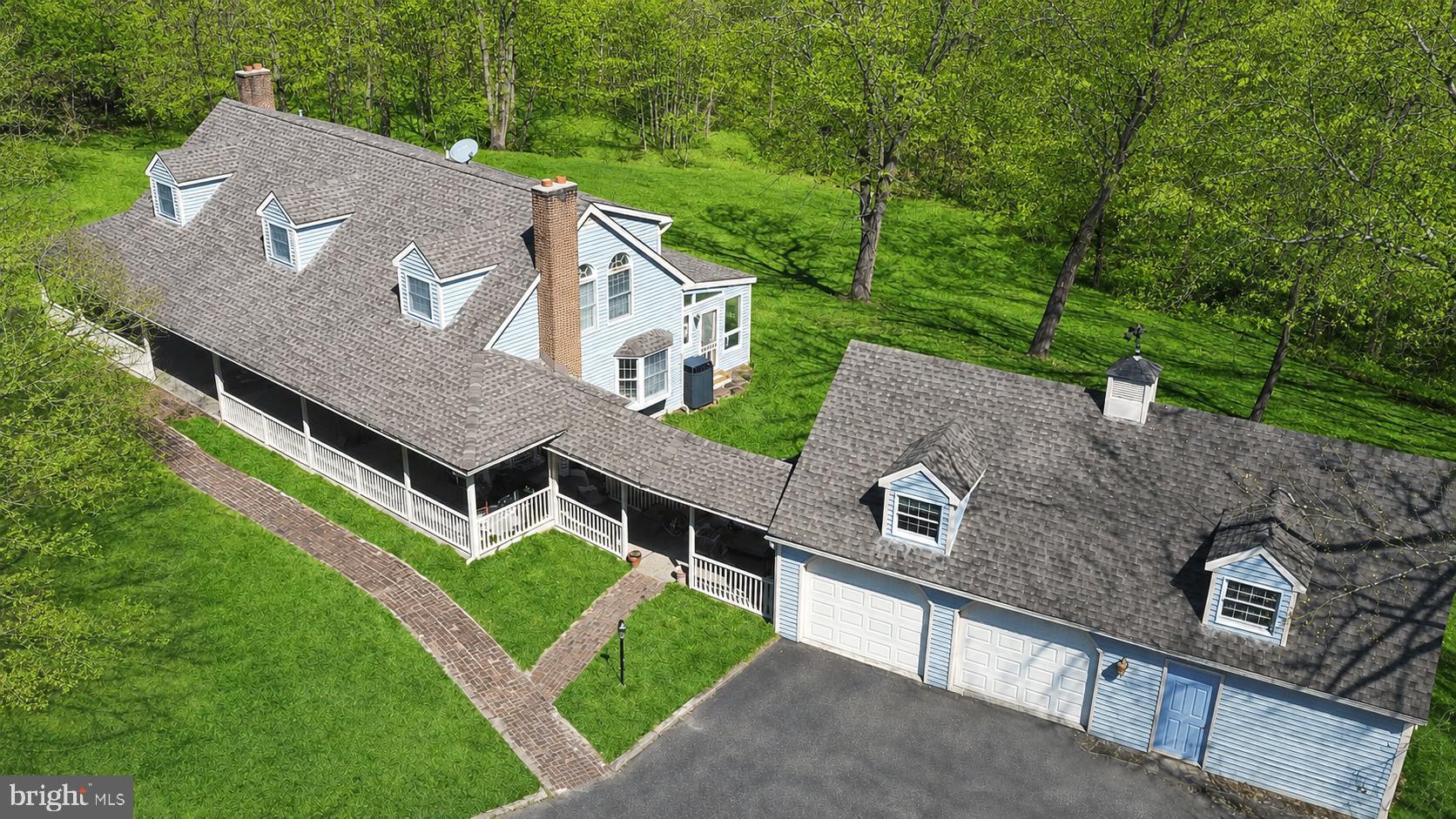 Escape to a private sanctuary offering the rare combination of a 2,700+ sq. ft. finished interior and 17 acres of pristine, tree-lined of wooded bliss. This charming Colonial greets you with a sweeping wraparound porch, perfect for quiet mornings overlooking your expansive grounds. The main level features a cozy family room with a fireplace, formal living and dining rooms, kitchen with pantry, half bathroom and a sun-drenched sunroom that leads to a rear deck—your front-row seat to local wildlife. 

Upstairs, the primary suite offers a true retreat with a soaking tub and separate shower, double sink vanity and double closets. Upper level hall is accompanied by three generous bedrooms, full bathroom and a convenient upper-level laundry. With an unfinished basement ready for your vision, this is more than a home; it’s a legacy property.

For the craftsman or collector, the property features a detached 2-car garage with an attached workshop and massive upper-level storage, complemented by a separate barn. 

This Baldwin gem is the ultimate private sanctuary ready for you to call home!