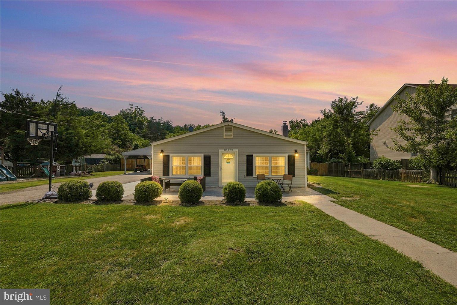 This thoughtfully upgraded ranch-style rambler sits on a private half-acre lot. Step inside, to a warm and inviting interior layout, featuring a freshly painted, beautiful farmhouse style modern kitchen with all stainless-steel appliances, quartz counters, a new back splash and a large center island - perfect for entertaining, hosting and family gatherings. Luxury vinyl plank wood flooring flows seamlessly throughout the main living areas enhancing the home’s clean and cohesive feel. The primary suite includes a newly expanded closet area for ample clothing space and a newly renovated laundry unit makes everyday living effortless. The best part is there two master bedrooms each with its own bathroom. 

Outside, the property continues to impress, providing plenty of room for outdoor activities.  The expansive front and backyard has a newly installed privacy fence, two storage sheds, a large playground, a concrete walkway, a concrete detached car-port garage with extra parking, and a concrete backyard patio- perfect for summer barbecues or quiet evenings.

Additional recent upgrades include: New recess lighting in the bedrooms, recess lighting in kitchen and living room; new attic window, new storm doors, new windows and new water heater.

Located just minutes from Masons Neck State Park and easy access to main roads - great for commuting! Embrace the opportunity to create your own sanctuary in this inviting retreat.