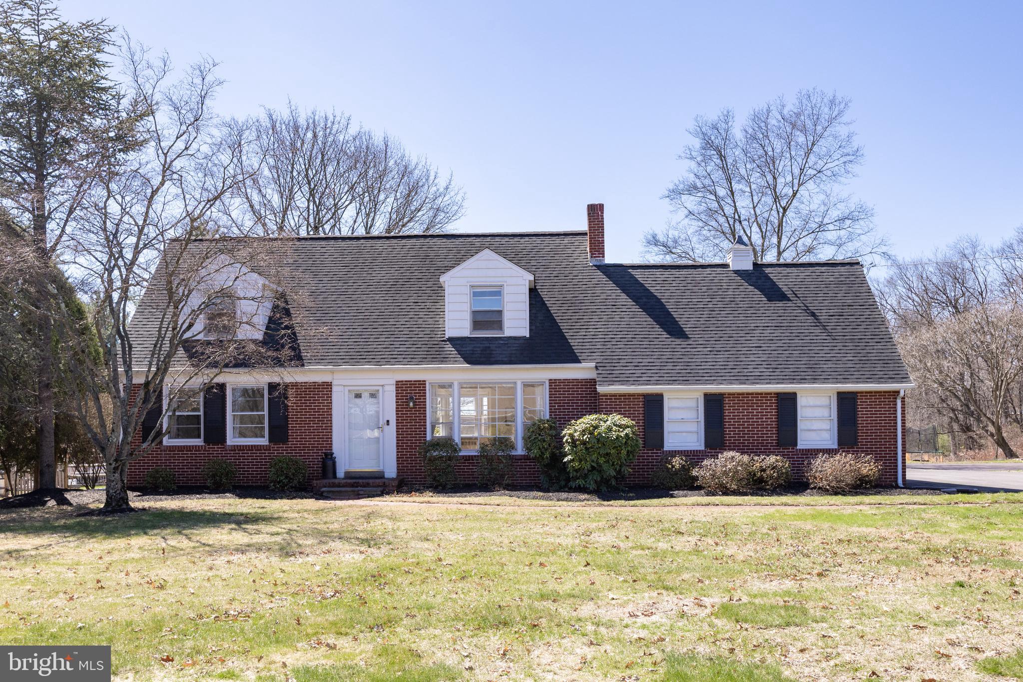 Welcome to 382 Oak Drive, a beautifully maintained 4-bedroom, 2-bathroom brick Cape Cod in the heart of Harleysville. This stunning home is a rare find, combining classic charm with thoughtful modern updates. Nestled on a large, level, one-acre lot, it offers boundless opportunities for outdoor enjoyment. Whether you dream of a flourishing garden, a peaceful patio, or the ultimate backyard oasis, this property is a canvas waiting for your vision. Step inside to a warm and inviting living space filled with natural light. The bright and airy living room boasts gleaming hardwood floors, a cozy bump-out reading nook, and a large picture window that frames the serene front yard. Recessed lighting enhances the ambiance, while an elegant oak staircase adds a timeless touch to this character-filled home. At the heart of the home, the beautifully updated kitchen is a chef’s delight. Designed with both style and function in mind, it features custom off-white distressed cabinets, sleek quartz countertops. Stainless steel appliances from GE Profile and Bosch provide superior performance, while a charming bead-board ceiling and tile backsplash infuse the space with character. A pantry cabinet with roll-out shelves ensures effortless storage, and under-cabinet lighting adds a soft glow to evening meal prep. The kitchen’s breakfast bar seamlessly connects to a spacious family room, where expansive windows showcase breathtaking backyard views. Whether you're hosting lively gatherings or enjoying a quiet evening, this space is destined to be the heart of daily living. One of the most captivating aspects of this home is the sun-drenched family room, a perfect retreat for any occasion. Imagine sipping your morning coffee while basking in the sunlight, transforming this space into a productive home office, or curling up with a good book as you take in the peaceful scenery outside. The main level offers two generously sized bedrooms with beautiful hardwood floors, along with a full bathroom featuring ceramic tile. Upstairs, two additional bedrooms provide ample space, each thoughtfully designed with built-in dressers, hardwood flooring, and a second beautifully updated bathroom. A bonus unfinished attic space, located off the primary bedroom, presents an exciting opportunity to create a luxurious walk-in closet, a cozy reading nook, or an additional flex space tailored to your needs. This home doesn’t just impress with its charm—it also boasts a variety of practical updates for modern living. A one-car attached garage provides convenience, while a newly expanded parking area ensures plenty of space for guests. Stay comfortable year-round with central air/split systems and a brand-new gas boiler installed in 2024. Additional upgrades include a new roof on the sunroom and shed, plus public water and sewer services. Location is everything, and this home is perfectly situated for both relaxation and accessibility. Just minutes from the Northeastern Extension of the Turnpike, Route 113, and a wealth of shopping and dining options, everything you need is within easy reach. Outdoor enthusiasts will love the proximity to Alderfer Park and scenic bike trails, making it simple to enjoy the beauty of Harleysville. Timeless character, modern comforts, and endless possibilities—382 Oak Drive is a place you’ll love to call home. Schedule your tour today and discover all the charm and potential this remarkable property has to offer!
