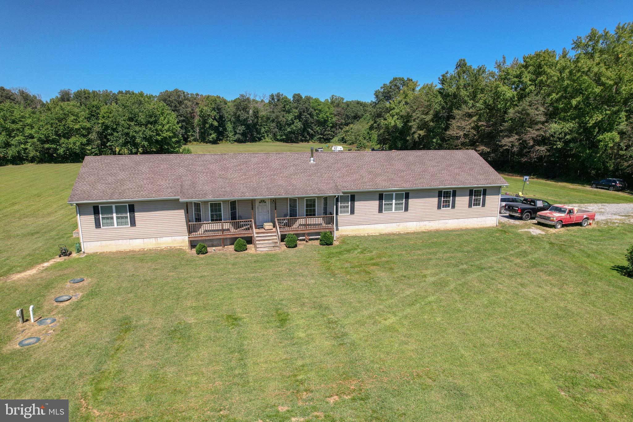 This is an almost 60 acre property with one main residence, one secondary residence, and 3ea 652’x67’, well-maintained chicken houses kept as clean as chicken houses can possibly be! There is still quite a bit of open land for expansion and possible income potential (ask about other opportunities). This would be an amazing multi-generational property or you could also live in the main house, and rent the 2nd house to a farmhand or anyone else. Outside the main home there is a 5th wheel hookup for any extra visitors you may have. The main home has 3 bedrooms, 3 full bathrooms (2 of which have marble countertops), plus 2 more rooms for offices, home schooling, etc, living room with wood stove, and large kitchen with dining area. The kitchen comes with a granite counters, gas stove, 2 wall ovens, and RO water system for the fridge and kitchen sink. There are 2 washer/dryer sets on the main floor in the laundry area next to the kitchen, a 2-car garage, and a full, unfinished basement with 2 sump pumps and 2 dehumidifiers. The whole-house generator also conveys with the property! A Rinnai constant gas water heater heats the water for the whole house. There is also a water conditioner connected to the whole house. Only ONE spigot outside is not softened, and that's for watering outside. If you have a lot of guests or a large family, rest easy knowing the septic is sized for 5BR.The 2nd home is a smaller 3BR/2BA Clayton home (about 1100sf) with its own well and septic and also has an RO in kitchen, water softener, and a Rinnai gas hot water heater for the whole house. Inquire for more details! Cross-listed with Farm listing: MLS# DEKT2040564
