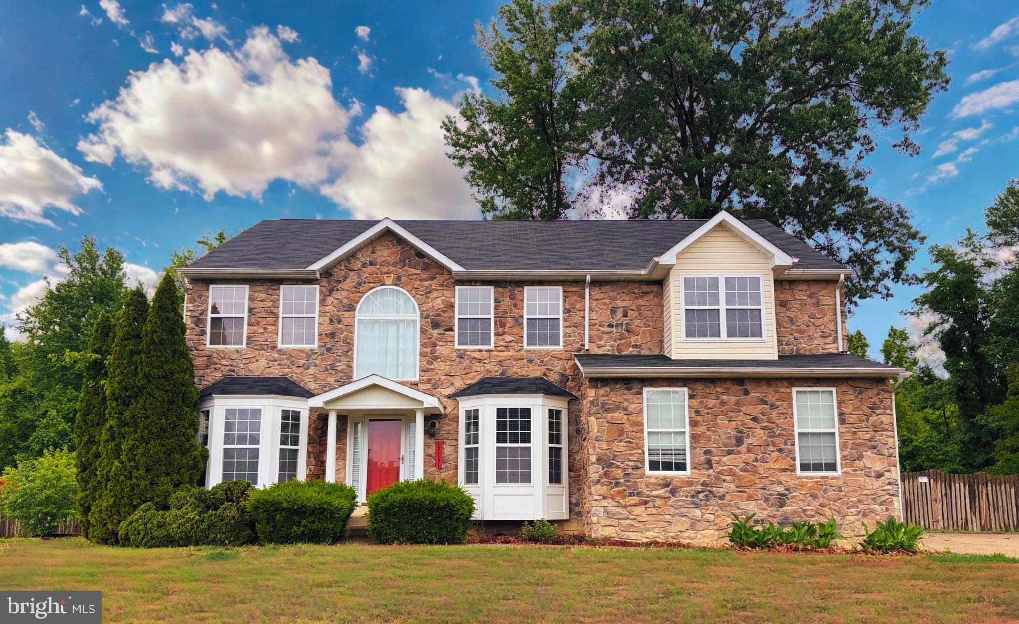 Looking for lots of space and a great location?  Don't miss this chance to make 17141 Leeward Ct yours.  This beautiful expansive colonial home provides so many great features inside and out.  As soon as you walk in, you are greeted with an open concept living and dining room with elegant hardwood flooring.  The two story family room has lots of natural light and opens directly into the kitchen.  The kitchen provides everything a chef could want with island range, wall oven, built in microwave, and lots of counterspace and pantry space.  Upstairs you will find 4 bedrooms, including the oversized master bedroom with vaulted ceiling, two large walk-in closets, and en-suite bathroom with soaking tub, shower, and dual sinks.  Laundry is conveniently located upstairs.  The home also has a fully finished basement with a 5th bedroom (NTC, no egress), full kitchen, bathroom, and second laundry hookups.  The basement has its own entrance making this the perfect space for additional rental income or multi-generational living.  Outside, the backyard is fully fenced and the property has fruit bearing pear tree, muscadine grapes, and blackberries.  This home is a short distance to Maryland,  and sits just outside the Dahlgren base.  The marina is just a short walk away.  You won’t want to miss this one!