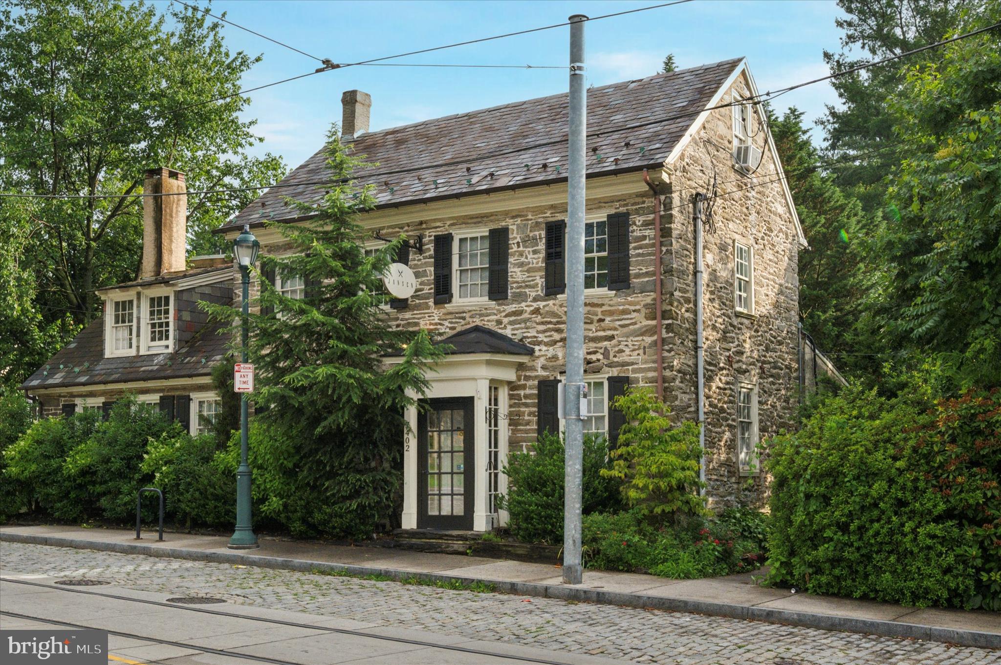 7402 Germantown Avenue, also known as the historic Cresheim Cottage, offers a rare opportunity to acquire a fully built-out, approximately 3,900 SF turnkey restaurant property ideally positioned along Germantown Avenue between Philadelphia’s highly sought-after Chestnut Hill and Mount Airy neighborhoods. Originally constructed circa 1700, this landmark building combines extraordinary historic character with modern hospitality infrastructure, including a fully equipped commercial kitchen with hood system, grease trap, and dedicated pâtisserie station. Formerly home to the acclaimed Jansen, the property features multiple elegant dining rooms, private event spaces, and a beautifully landscaped outdoor patio that creates a truly distinctive al fresco dining experience and serves as one of the property’s signature amenities. Situated at the prominent corner of Germantown and Gowen Avenues along one of Northwest Philadelphia’s most desirable and walkable commercial corridors, this exceptional asset is ideal for restaurateurs, investors, or hospitality operators seeking a one-of-a-kind destination property.
