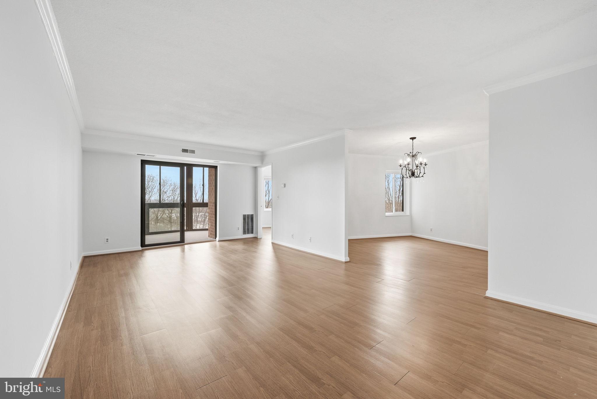 Open House: Saturday, June 6th 12-2pm
Price Improvement! 
This beautiful 3 bedroom, 2 bathroom condo offers 1,500 square feet of refined living space in one of McLean’s most sought-after and convenient communities.
This large, bright unit provides a wonderful backdrop for both everyday living and entertaining. It features a spacious living room, formal dining room, well-appointed kitchen, and a light-filled sunroom.  
The unit features luxury vinyl plank flooring throughout the living room, dining room, kitchen, and third bedroom. Fresh paint, updated lighting fixtures, and brand-new carpet in two bedrooms and the sunroom give the home a crisp, refreshed feel. Expansive windows and two sliding glass doors flood the space with natural light and open to the enclosed balcony — the perfect spot to relax and enjoy lovely views.
The bright, polished kitchen offers abundant cabinet storage and generous counter space, along with room for casual dining. For added convenience, a stacked washer and dryer are discreetly tucked away within the kitchen area.  
The quaint primary suite features a walk-in closet, en-suite full bath, oversized windows with plantation shutters, and abundant natural light. The second bedroom boasts floor-to-ceiling windows as sliding doors lead directly from the bedroom to the sunroom.  
The Rotonda Condo Community sits on 34 acres of private, beautifully landscaped grounds and resort-like amenities. Its community center features a library, kids play area, a fitness/workout center, yoga studio, indoor pool, outdoor pool, locker rooms with sauna and showers, a game room with billiards, foosball table and plenty of seating, and more. Outdoor amenities include basketball courts, volleyball courts, a dog park, and walking trails. 
Easy access to major commuter routes including Route 7, 495, the Dulles Toll Road and the Silver Line Metro is close by as well. Quick access to all of the amenities Tyson’s Corner has to offer.  Parking Spot 91 on level B1.
