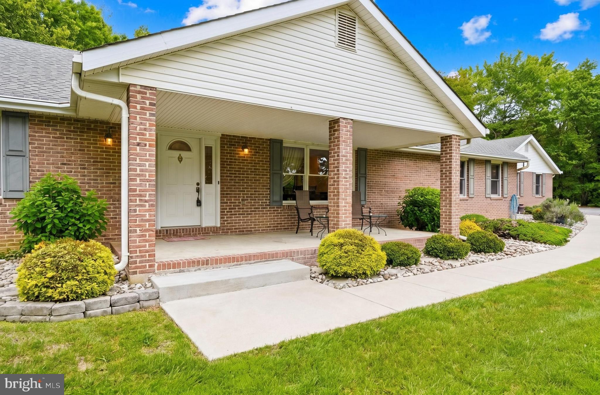 Nestled on three private acres within an established and highly sought-after community in La Plata, this custom-built all-brick rambler offers more than 3,500 square feet of beautifully designed living space. Showcasing spacious rooms, stunning solid hardwood floors & details, and generously sized walk-in closets, this exceptional home features four large bedrooms, 3.5 baths, a formal living room with vaulted ceilings and a wood burning fireplace,  a traditional formal dining room ideal for entertaining family and friends.
The warm and inviting family room flows seamlessly into the kitchen and adjoining three-season room/enclosed porch, creating the perfect setting for both everyday living and special gatherings. Additional highlights include an oversized two-car garage and an expansive lower level complete with a large open recreation room, half bath, and an abundance of storage space.

Perfectly positioned on an extremely private lot, the property is surrounded by mature landscaping and peaceful natural beauty. Multiple porches and a deck provides the ideal places to relax and enjoy the serene setting. The level backyard offers endless possibilities, including space for a future pool, detached garage, or workshop.

Nature lovers will truly appreciate the thoughtfully curated landscape, featuring peach trees, wild black cherry trees, dogwoods, crape myrtles, seasonal flowers, several varieties of oak and evergreen trees, as well as indigenous woodland species, American persimmons, and pawpaw trees.

This remarkable property is a rare opportunity offering privacy, beauty, and timeless quality. With no homeowners association and no Town of La Plata taxes, this home delivers the perfect blend of peaceful living and everyday convenience. A truly must-see property that is sure to impress from the moment you arrive.