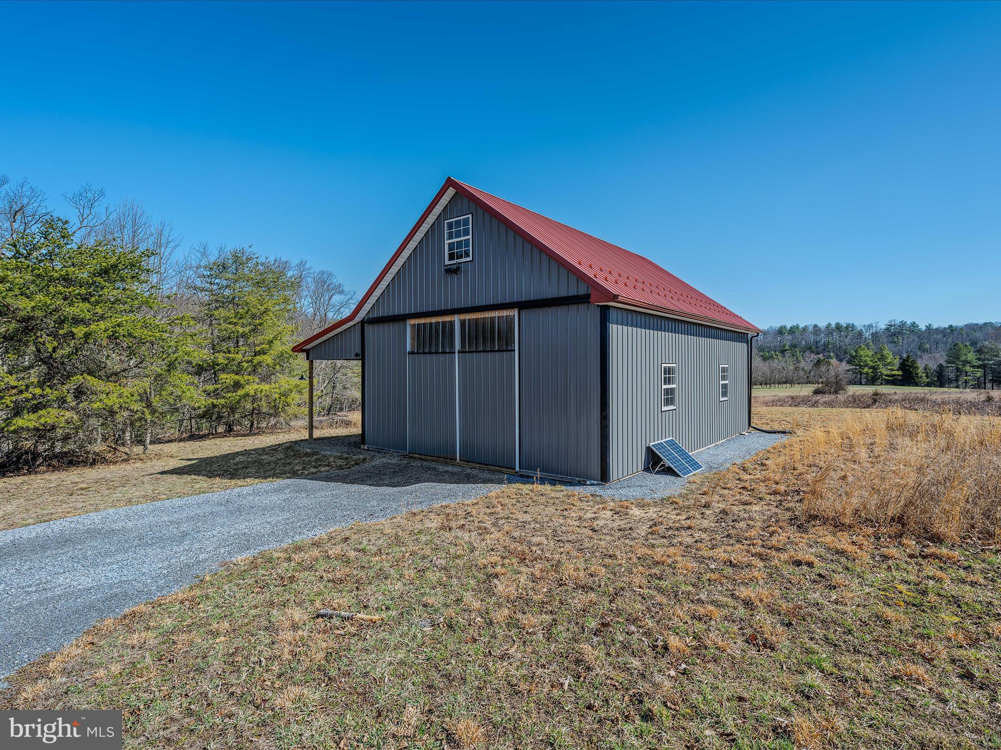 3 lots totaling 7.41 acres of beautiful open land that reaches down to the Sleepy Creek and in some places across the creek.  The barndominium style shell is completed on the exterior.  Sellers have enjoyed the property as their weekend getaway off the grid.  They have watched the eagles soar, enjoyed  fishing, stargazing, and quiet nights around the campfire.  Original Septic permits available.  Enjoy as they have or have your builder come in and complete the project for full time living.  Hike to creek from the property or walk to the common area and follow the path to the Sleepy Creek.