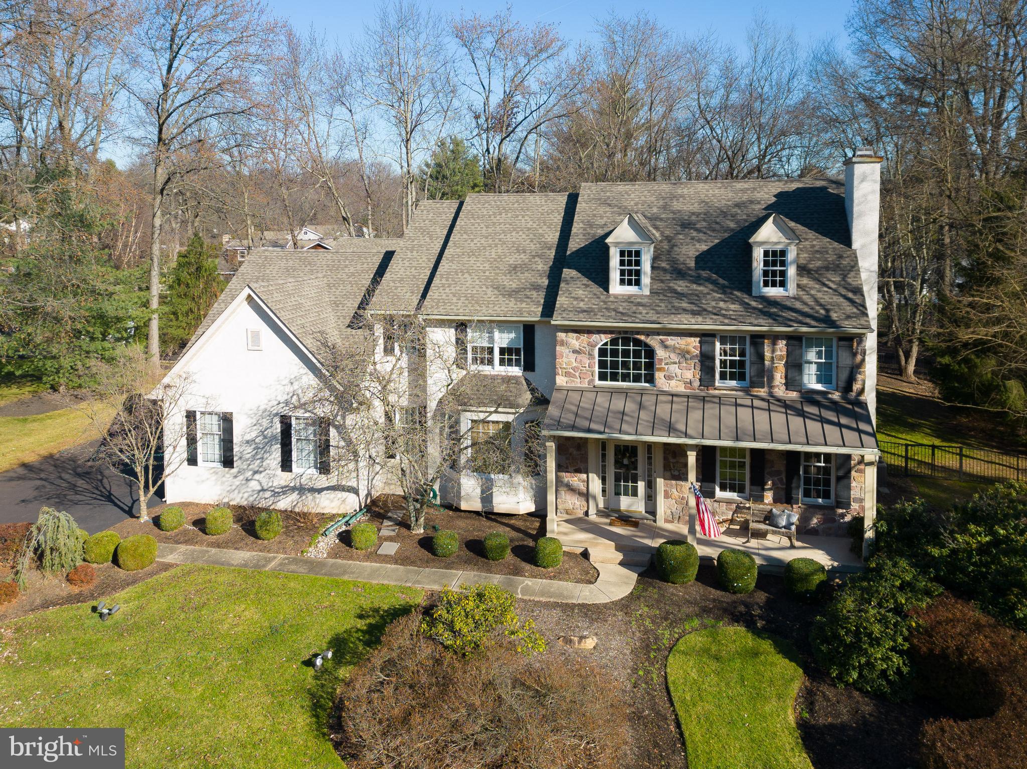 Welcome to the heart of Lower Gwynedd, where this expansive 5-bedroom, 4 full, 2 half bathroom Westrum-built Colonial Farmhouse, offers over 7000 square feet of living space and extends a warm welcome with its inviting features. It's a perfect haven for multi-generational living. Nestled on a generous 3/4-acre lot in the Wooded Pond community, this residence seamlessly blends modern comfort with timeless charm, highlighted by the appeal of its welcoming front porch.  Adding to the allure, the exterior of this home exudes curb appeal, showcasing a stone and stucco facade complemented by the expansive front porch—a perfect spot to unwind and enjoy the relaxed atmosphere. Practicality meets aesthetics as a 4-car garage maintains the inviting exterior without compromising convenience.  Step inside and the kitchen emerges as a central hub for culinary exploration and casual gatherings. Seamlessly connected to the dining area, this space encourages the creation of lasting memories. Renovated bathrooms throughout the home introduce a contemporary touch, elevating the overall appeal. The bedrooms, including a luxurious primary suite, provide comfortable retreats for rest and rejuvenation. Recognizing the importance of remote work, a much-needed home office is thoughtfully incorporated, offering a dedicated area to enhance productivity. The main floor office, featuring glass-paneled doors for privacy, adds to the practical work-from-home options. For those seeking multi-generational living, it's the in-law suite that takes center stage, contributing to the over 7000 square feet of living space. Complete with its own kitchen and bath, this space adds a layer of flexibility to this home. Whether hosting guests or transforming it into a pool house for the heated in-ground pool, the in-law suite adapts to your evolving lifestyle.  The finished basement contributes versatility, providing room for hobbies, workouts, or an additional home office. Wooded Pond's access to walking trails offers a scenic escape right at your doorstep. Quick drives to the Ambler YMCA, Springhouse shopping center, and the charming town of Ambler, coupled with proximity to multiple private schools, enhance daily convenience.
830 Wooded Pond is more than a house: it's a welcoming home in a sought-after community. Top-ranked Wissahickon School District ensures an excellent education, and proximity to private schools provides additional educational options. Discover a place where comfort meets charm in Lower Gwynedd—a haven that truly feels like home. Schedule your showing TODAY!