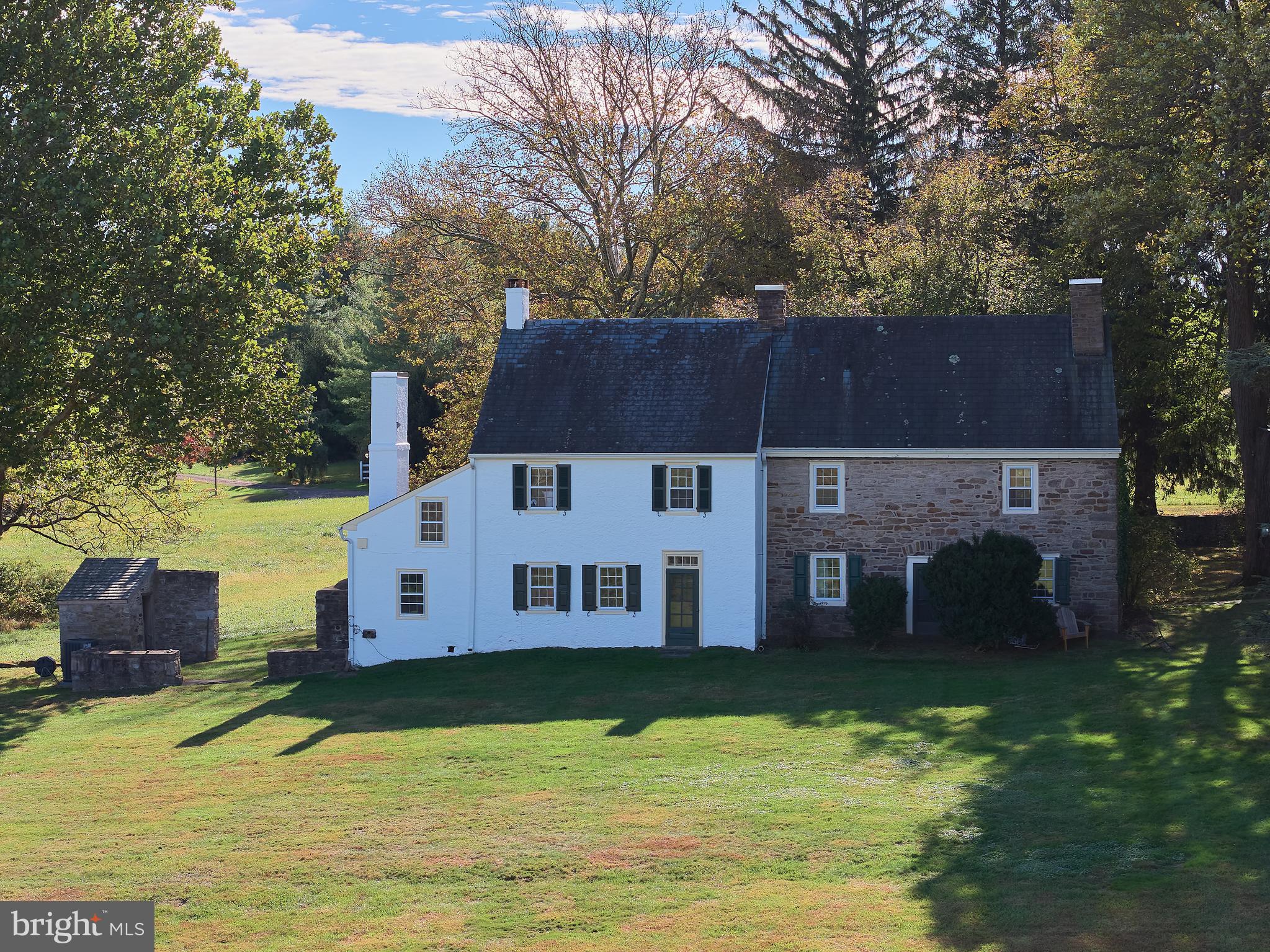 Lindencroft,  home of Bucks County Writer, Willis Rivinus, presents a rare opportunity to acquire a quintessential Bucks County farmhouse on 49 acres of countryside beauty on the iconic Paxson Rd. The land was first deeded by William  Penn in 1681. Amid sweeping fields, meadows, and woodlands, this timeless stone 1735 farmhouse presents an extraordinary opportunity to create a one-of-a-kind luxury estate. Rich in history and character, the home stands as a testament to classic craftsmanship—ready to be reimagined and restored to its full grandeur.  The original stone residence offers enduring architectural beauty, with deep-set windows, vintage beams, and authentic materials that speak to a bygone era. A thoughtful renovation could blend these historic elements with the finest modern amenities, resulting in a stunning country retreat tailored to today’s lifestyle.  The expansive acreage provides endless possibilities for a private compound, equestrian estate, or gentleman’s farm—complete with potential for an additional dwellings, stables, or recreational spaces. Sweeping views, serene privacy, and a true connection to nature make this property an unparalleled canvas for your vision.  Opportunities of this scale and setting are increasingly rare. For the discerning buyer seeking a legacy property with both historic charm and limitless potential, this 49-acre estate offers the perfect foundation to create something truly exceptional.
