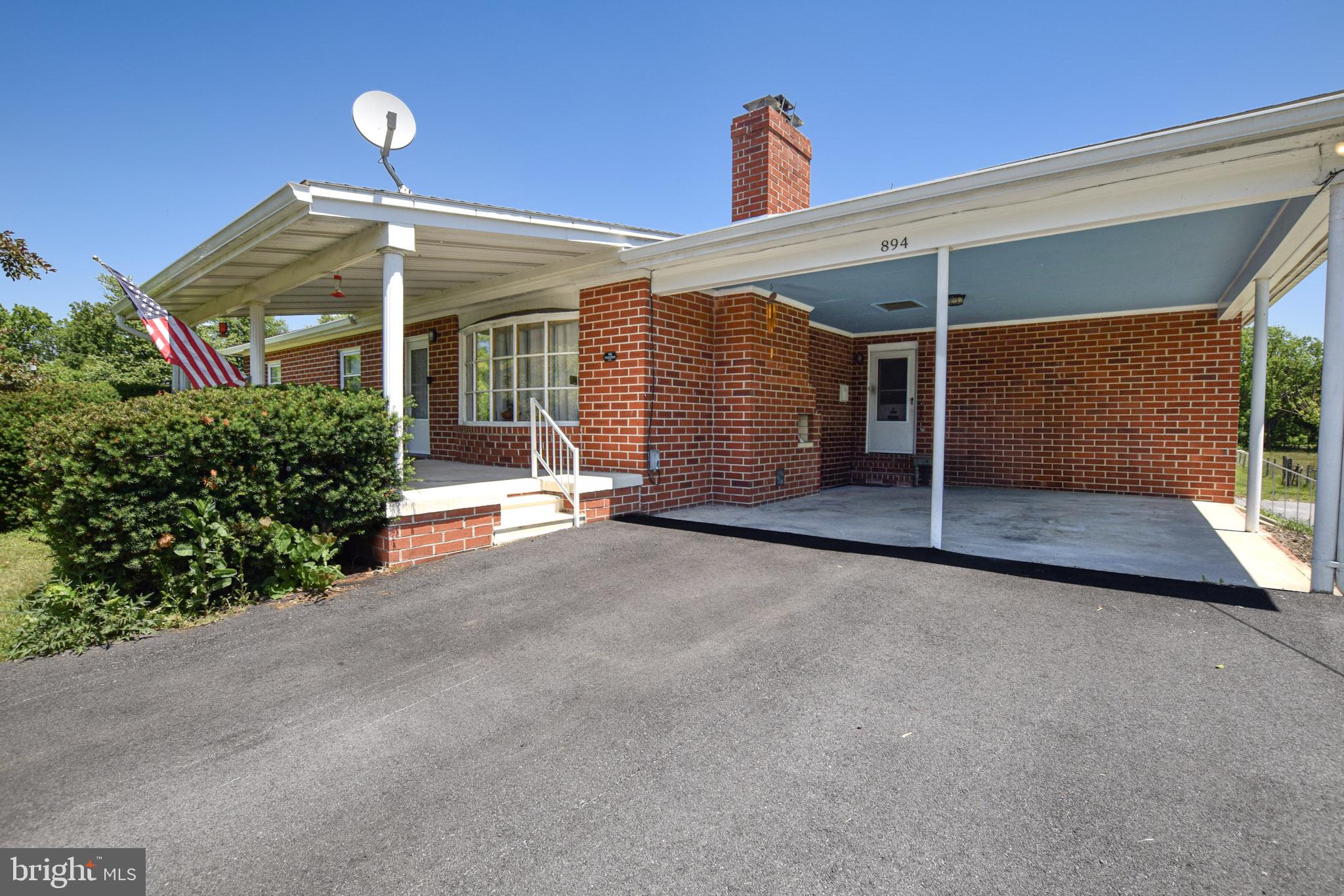 Experience the freedom of authentic country living with this classic 3-bed, 2-bath brick rancher situated on 2.18 unrestricted acres with NO HOA. Inside, enjoy comfortable one-level living complemented by a cozy wood-burning fireplace, perfect for relaxing evenings.  Both full bathrooms have been completely and tastefully renovated, offering modern fixtures, crisp finishes, and turnkey comfort. The home features a unique, sun-drenched plant room that is perfect for starting seeds or overwintering your favorite greenery. Additionally, there is a fully enclosed back porch creating a multipurpose space perfect for a mudroom or sunroom. Downstairs, a sprawling full basement offers a root cellar as well as endless possibilities for storage or future finished living space. This property comes complete with a barn and a spacious detached garage, providing abundant room for animals, equipment, vehicles, and hobbies. Whether you are looking to raise livestock, cultivate crops, or park heavy equipment, this unrestricted property is ready for your vision.