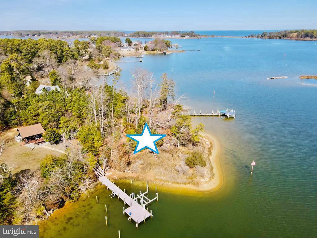 Prime Waterfront Parcel with Stunning Views and Sandy Shoreline!
This exceptional property offers a rare opportunity to build your dream getaway home with panoramic views and refreshing breezes. Located on a point along the Little Wicomico River,  just minutes from the Chesapeake Bay.  A pier permit has been created by Army Core of Engineers, and the soil has been approved for a septic system. You can build up to the 60-foot RPA line, maximizing your water views. Watch boats come and go from nearby Smith Point Marina, and enjoy access to some of the Bay’s best fishing grounds. You won't find a better location or view—this is truly a waterfront gem!