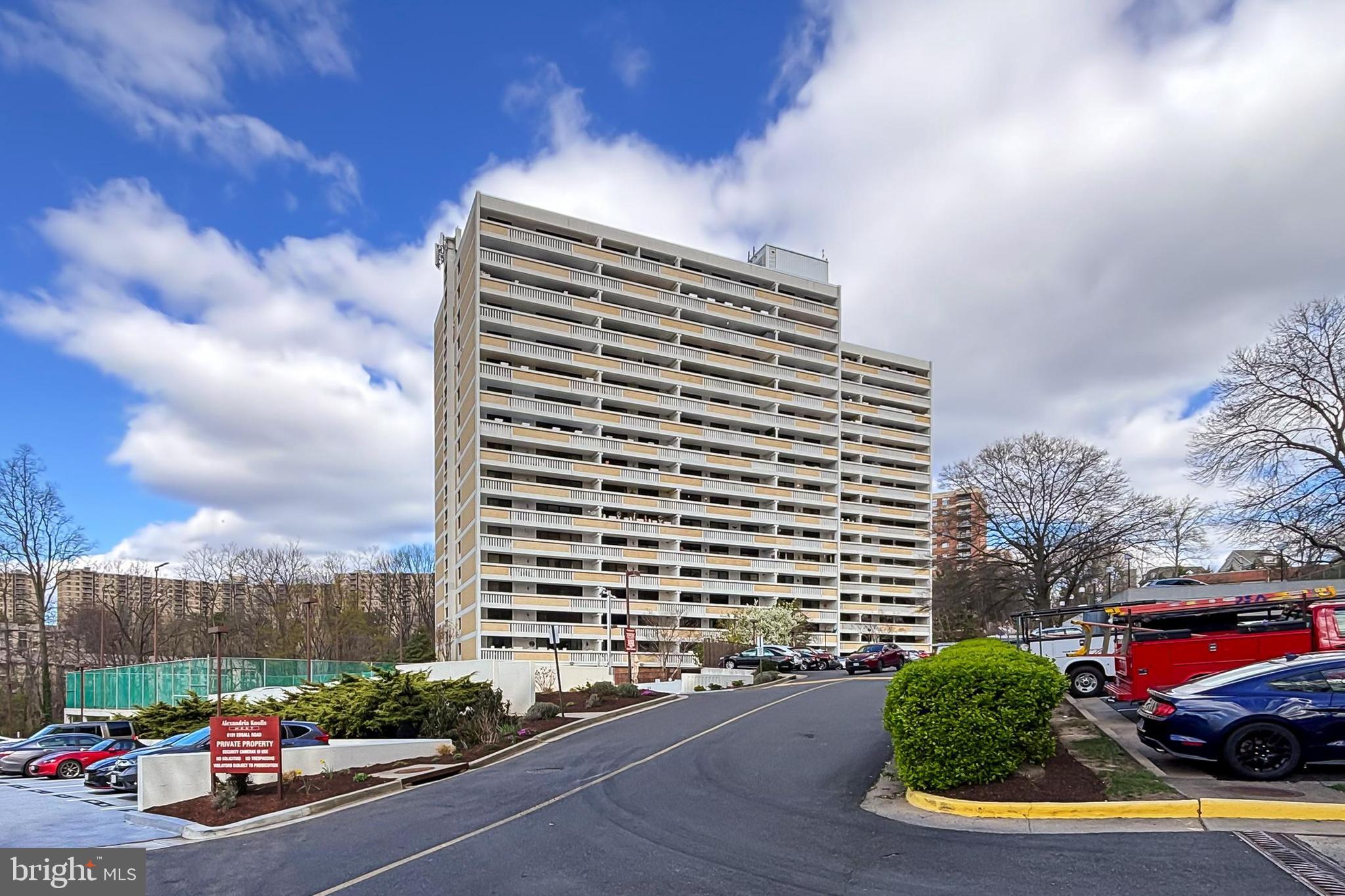 Comfort, convenience, and sweeping city views come together beautifully in this inviting 2-bedroom, 2-bath condominium nestled within the sought-after Alexandria Knolls community. Perched on the 12th floor, this spacious residence offers an open floor plan, expansive balconies, luxury vinyl plank flooring, neutral paint, and an impressive collection of community amenities that create an easy, low-maintenance lifestyle in an exceptional Alexandria location. 

A welcoming foyer with warm hardwood-style flooring opens into the bright and spacious living area, where a sliding glass door leads to the expansive balcony overlooking the cityscape beyond. Whether enjoying morning coffee, evening sunsets, or simply unwinding after a long day, the outdoor space offers the perfect extension of everyday living. Back inside, the dining area provides comfortable space for both formal gatherings and casual meals, while a classic candelabra chandelier adds a touch of timeless character. The galley-style kitchen offers generous cabinetry and abundant potential for future personalization, while a modern wash tower, adjoining pantry, and dedicated storage room add convenience and functionality to the main living space.

The spacious primary suite features room for a sitting area, two walk-in closets, and a private bath with a tub and shower combination. A separate private balcony creates a peaceful retreat ideal for relaxing with a favorite book or enjoying the evening skyline. An additional bright and versatile bedroom offers generous closet space, private balcony access, and easy proximity to the hall bath, making the space well suited for guests, a home office, or everyday flexibility.

Alexandria Knolls delivers an impressive collection of amenities including an elegant lobby, concierge service, outdoor pool, hot tub, tennis courts, fitness center, sauna, party room, community center, and 24-hour security. Ideally located near major commuter routes, shopping, dining, and entertainment, this home also enjoys close proximity to Bren Mar Park and numerous outdoor recreation opportunities. Combining comfort, convenience, and wonderful views in the heart of Alexandria, this residence offers the perfect opportunity to enjoy easy condominium living. Welcome Home!