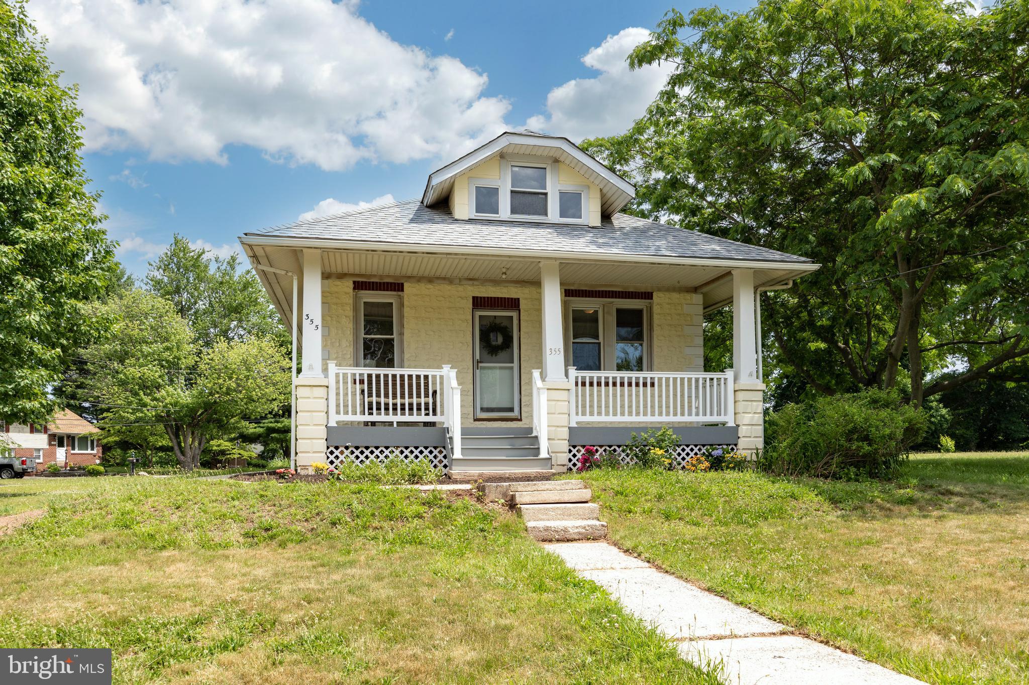 Welcome to this charming Sears Craftsman-style home, perfectly situated on over an acre of level property in Upper Providence Township and within the highly sought-after Spring-Ford Area School District. This well-maintained home offers comfortable living both inside and out. A newer covered front porch with low-maintenance Trex-style decking stretches across the front of the home, creating the perfect place to relax and enjoy the peaceful setting. Inside, you'll find plenty of natural light, freshly painted neutral decor, and a warm, inviting atmosphere throughout. The living room, dining room, and kitchen have crown molding, while beautiful wood flooring flows through the main living areas. Brand-new carpeting has been installed in all three bedrooms, making this home truly move-in ready. The spacious living and dining rooms provide excellent gathering spaces for everyday living and entertaining. The updated kitchen features freshly painted white cabinetry, granite countertops, tile backsplash, stainless steel appliances, a pantry closet, and ample workspace for meal preparation. Just off the kitchen is an oversized laundry and mudroom, offering exceptional storage and functionality. Three comfortable bedrooms share an updated hall bath featuring a new vanity and flooring. Additional storage and workspace can be found in the heated basement, complete with its own thermostat and heating zone, making it ideal for hobbies, projects, a workshop, or year-round storage. Outside, the level rear and side yards offer endless possibilities. With over an acre of usable ground, there is plenty of room for outdoor entertaining, gardening, recreation, or even the pool you've always wanted. A detached 30' x 20' garage with electric service provides excellent space for vehicles, equipment, or a workshop. Major improvements include a new roof and freshly painted exterior in 2024, providing peace of mind for years to come. Conveniently located just minutes from the Spring Valley YMCA, shopping, dining, parks, and major commuter routes including Routes 422, 29, and 113, this home offers easy access to King of Prussia, Phoenixville, and Collegeville while maintaining the charm and space of a more private setting. Enjoy the best of both worlds—a picturesque property with room to grow, all within one of the area's most desirable school districts.