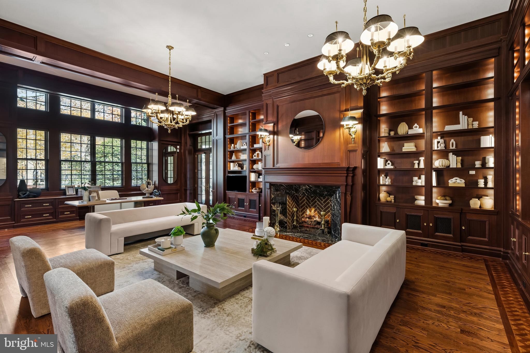 Nestled in the heart of Caves Valley Golf Club and Residences, this completely custom-designed estate offers an extraordinary lifestyle of luxury, craftsmanship, and state-of-the-art systems. With over 11,000 square feet of impeccably designed living space, this home is crafted from the finest materials and features every amenity for a life of elegance and ease.  Upon entering through the marble foyer, you’re greeted by the grandeur of the Great Room, featuring custom cherry built-ins and a striking fireplace wall. The banquet-sized Dining Room is adorned with marble floors and a built-in cherry breakfront, making it ideal for entertaining. A stunning mahogany Library, complete with a fireplace and spiral staircase, leads to the Billiard Room. The gourmet Kitchen, equipped with SubZero, Viking, and Thermador appliances, showcases cherry cabinets and granite countertops. The main level also includes a cozy breakfast area, Butler's Pantry, Wet Bar, Home Office,  Laundry Room, and two half baths.  The luxurious first-floor Primary Suite offers a private retreat, complete with a marble spa bath, two Dressing Rooms, and stunning views. Upstairs, three large en-suite bedrooms, one with French doors leading to a roof deck overlooking Caves Valley, provide ample space and comfort. The expansive lower level features a Billiard Room with wet bar, Game Room, Driving Range/Putting Green, Rec Room, Exercise Room, Additional Bedroom with an ensuite bath,  making it perfect for relaxation and entertainment. Outside, the home’s sweeping patios, covered porches, screened porch with a cooking center, koi pond, and lush landscaping on 2.4 acres create a private oasis. From here, you’ll enjoy the most spectacular vistas and sightlines, capturing the expansiveness of the 8th fairway and green, views of the 9th tee box, and the picturesque Greenspring Valley. This exquisite stone and stucco home, with its cedar shake roof, is perfectly positioned over the signature 8th green and the finishing 9th tee box of the renowned Caves Valley Golf Course. Beyond the home’s impeccable features, residents enjoy access to the Caves Valley Tranquility Center, offering 24/7 concierge services that enhance the ease of everyday living. A short stroll from your doorstep brings you to the first tee or world-class dining, ensuring every moment is as seamless as it is luxurious. Whether you're an avid golfer or simply seeking the tranquility and prestige of this coveted community, this home provides an unrivaled living experience on a truly one-of-a-kind homesite.
