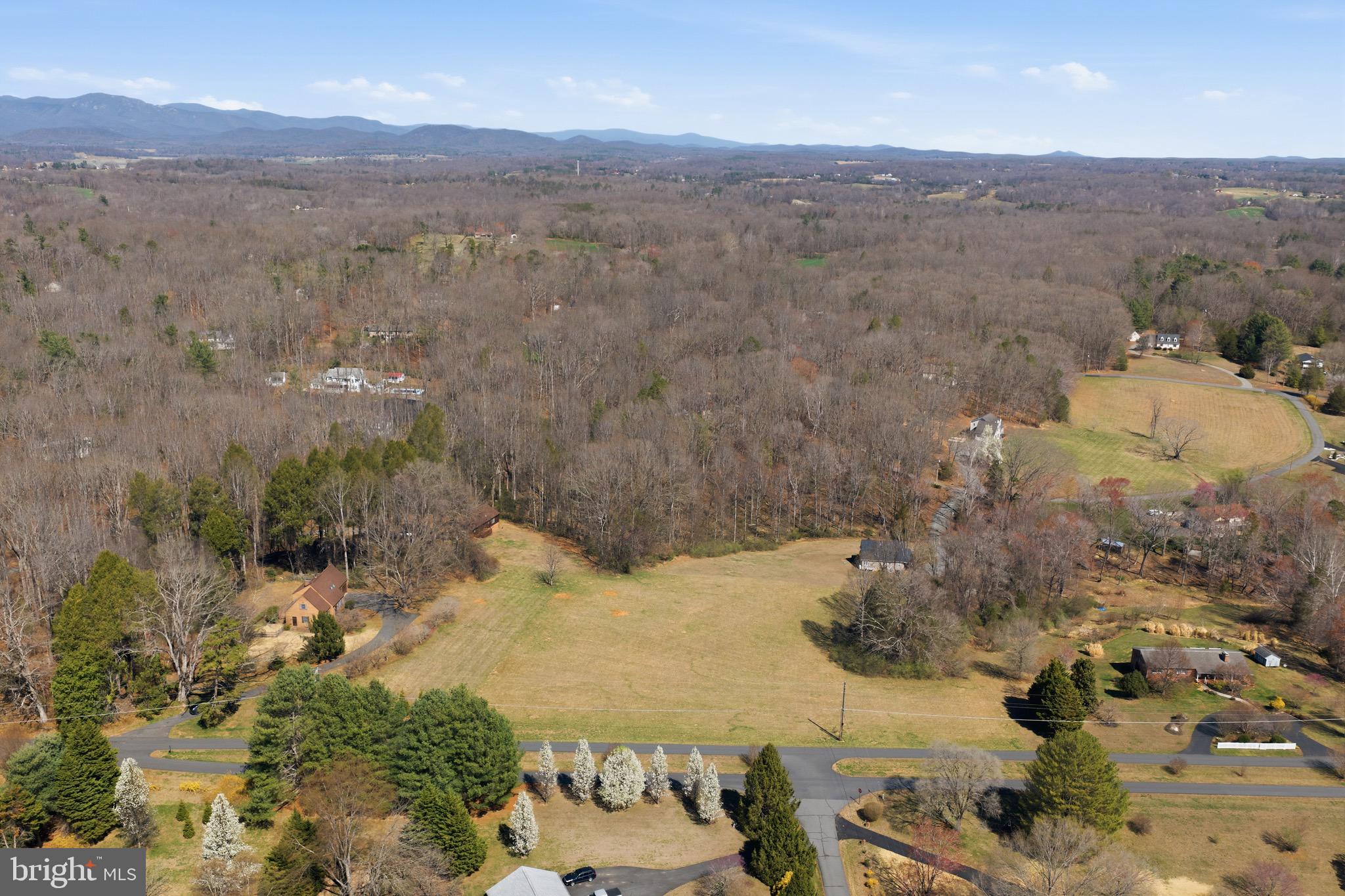 Large, open and buildable lot in Malvern of Madison awaits your builder--or we will introduce you to one. This 3.07-acre lot lies right on Malvern Drive just past the entry to Malvern of Madison community. The well-established and friendly community boasts a clubhouse, recreational lake, outdoor pool and play area for children. The lot has been perc'd and the septic designer is ready to submit a permit for a septic system for buyers. Sale is subject to county approval of pending septic drainfield easement. Septic drainfield for 359 Madison Drive lies within the confines of this property, along a portion of the western property line.