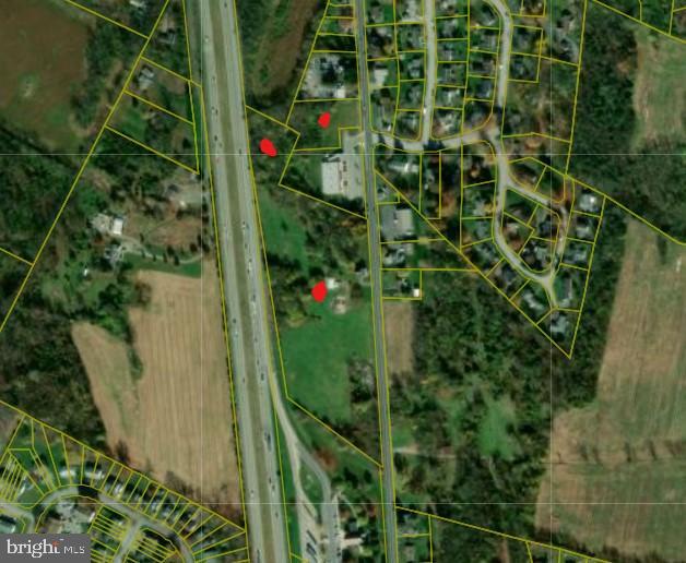 Approx 13 acres of land for commercial use on Molly Pitcher Highway, backs Interstate 81, joins PA Welcome Center.  Property is zoned Community Commercial.
In Franklin County, situated along Interstate 81 in south central Pennsylvania, approx 50 miles south of Harrisburg, and 90 miles west of Baltimore-Washington Beltways.
Property includes 2 parcels.
There is an old house and garage on the property that has not been used in years.  Seller does use garage, any contents do not convey.
