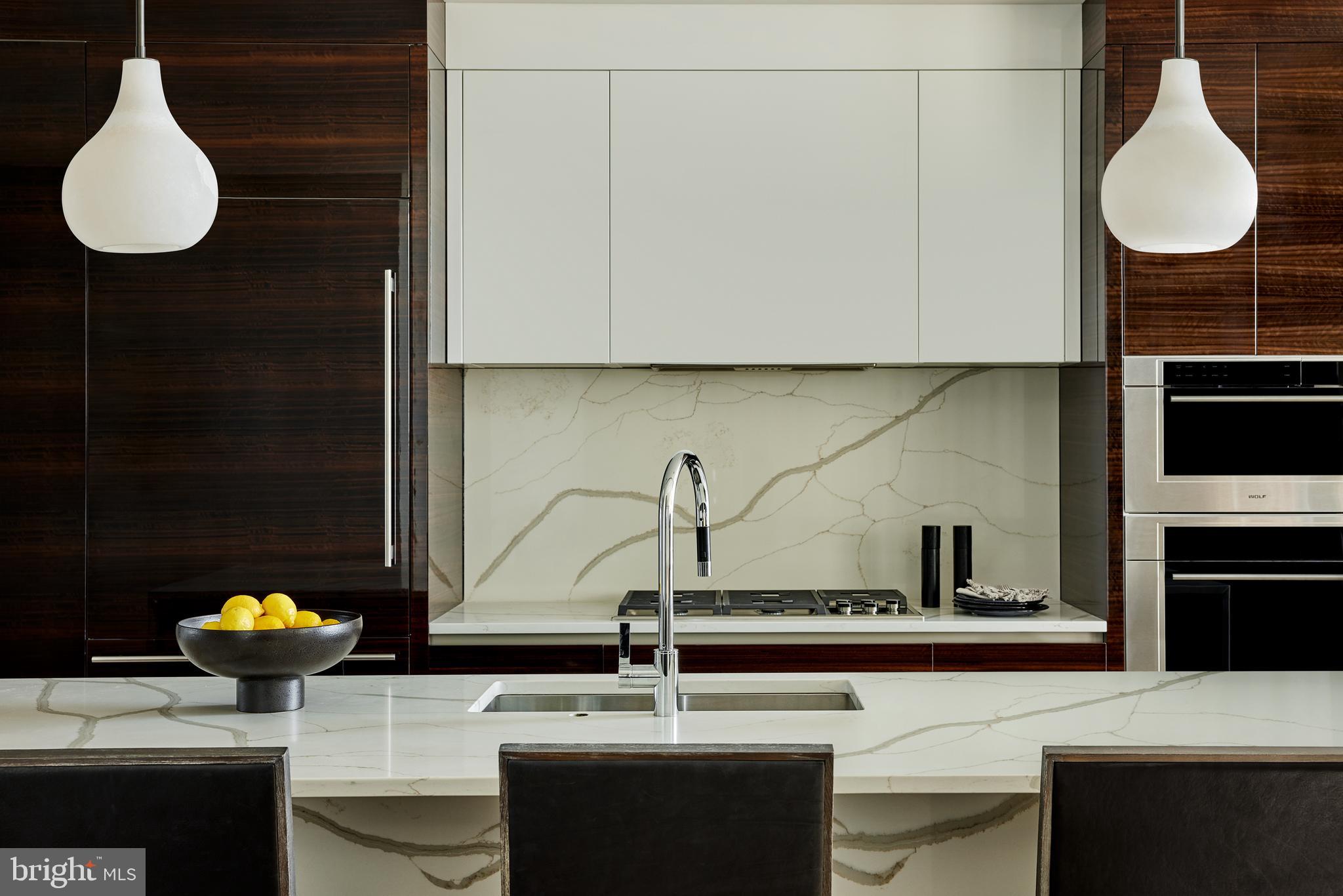 Welcome to The Laurel. Named for Pennsylvania's state flower, The Laurel introduces a lifestyle worthy of this final residential opportunity on prestigious Rittenhouse Square. With hotel-like amenities included for all owners, we offer the carefree enjoyment of city living. The meticulously curated array of services and amenities include an indoor and outdoor saltwater pool along with a stunning club room and expansive terrace overlooking the Square. "Above it All" with panoramic vistas of city and sky, we are the tallest all residential building in Philadelphia. The Sky Residence 2(S2) is a 3 bedroom/3bath unit located on the South West corner. The western views from the expansive wraparound windows in the living and dining areas showcase the beautiful sunsets over the Schuylkill River. Over 2179 square feet of luxury awaits you. Featuring 10 foot ceilings, 8 foot doors and a balcony with views of Rittenhhouse Square, this home is sure to  WOW ! The custom built furniture style European kitchen cabinets in a high gloss white finish that flow  into open living and dining areas. The appliance package includes a Sub-Zero integrated refrigerator, Wolf gas cooktop, state of the art steam oven and full size convection oven. The oversized kitchen island features Quartz counters with waterfall edges, a large under mounted sink, Dornbracht faucet, Meile dishwasher and under-counter drawer microwave. The primary bathroom is complimented by an expansive shower with Fantini shower fixtures. The luxurious freestanding soaking tub sits atop stunning marble floors surrounded by floor to ceiling porcelain walls. A laundry room with full size Maytag washer and vented dryer complete this magnificent residence. One parking space included. Inquire about additional parking availability. Our on-site Sales Gallery is open 7 days a week.