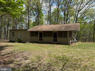 This listing includes 2 parcels totaling 48.6 acres. There is lots of possibilities with these parcels of land. It offers privacy, natural beauty, and future opportunity! Tucked away along a state-maintained road, this tract provides a secluded setting while still maintaining accessibility. There is a cabin on that includes a propane stove for cooking and a woodstove for heat as well as a pump well for water. Electric is accessible through nearby property. Such potential on these 2 parcels that add up to almost 50 acres!