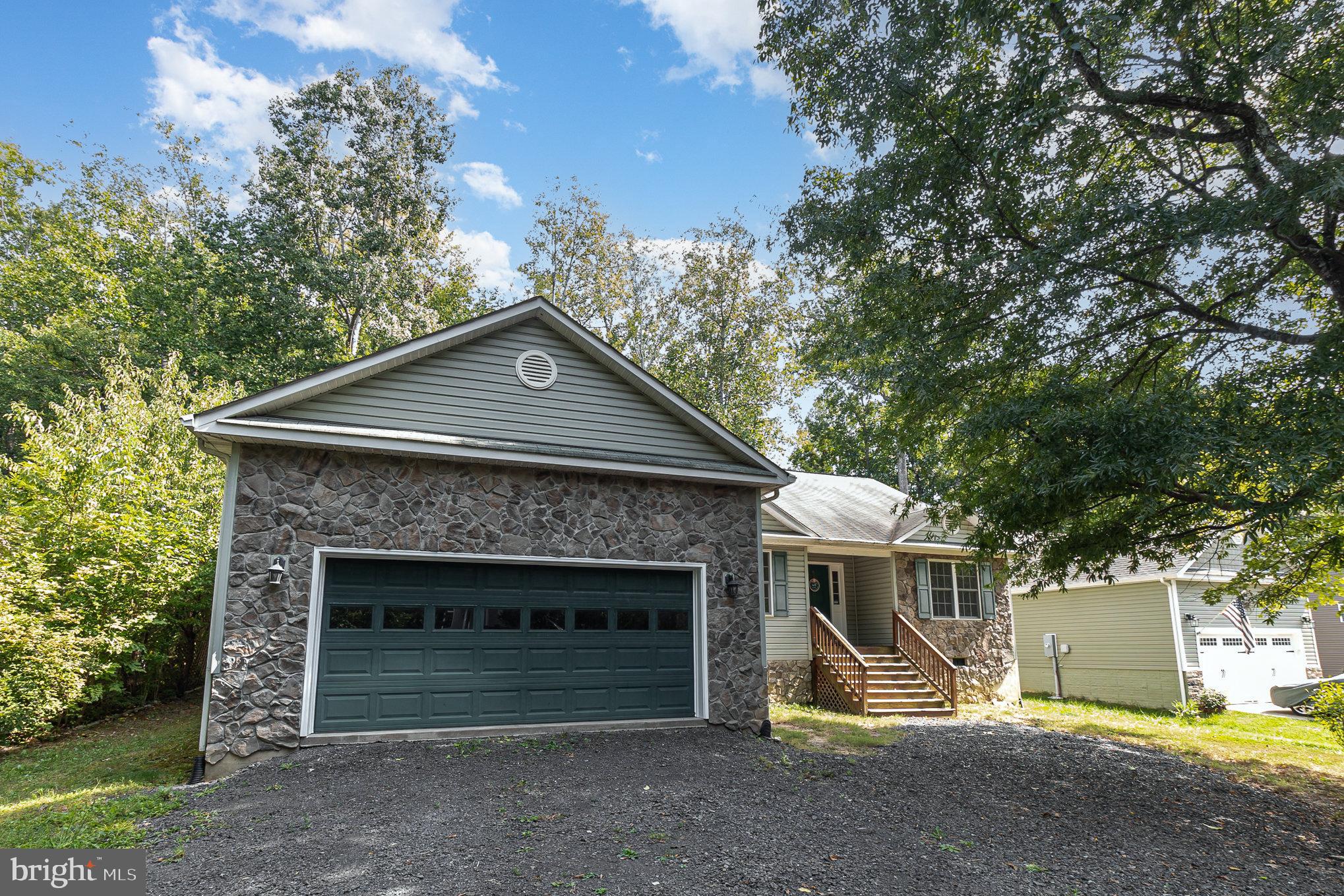 Welcome to this stunning 4 bedroom, 2.5 bathroom home in the desirable Lake of the Woods community in Locust Grove. This spacious house features soaring ceilings, a cozy fireplace, a deck for outdoor entertaining, and a screened porch for enjoying the peaceful surroundings. With plenty of room for relaxation and gatherings, this home is perfect for those looking for a comfortable and inviting space. All brand new flooring is throughout, and fresh paint is used throughout.  Professional photos are coming soon.