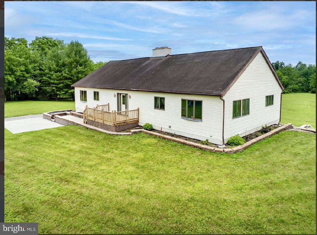 Welcome to 344 Hallman Mill Road in Phoenixville. This raised ranch home sits on nearly 10 beautiful acres and offers endless potential for the right buyer.

Built by the current owner 22 years ago, this three-bedroom home is now ready for someone to bring their vision and finishing touches to life.

Step through the front door and you’ll be greeted by a stunning floor-to-ceiling stone fireplace that has never been used, soaring cathedral ceilings, and custom built-in cabinetry spanning the length of the living room. The spacious kitchen opens to a large dining area filled with natural light.

Down the hall, you’ll find a full hall bathroom, two generously sized bedrooms, and the primary suite. The primary bedroom features a large walk-in closet and plumbing already in place for a future en-suite bathroom.

The living room, kitchen, and primary bedroom all feature sliding glass doors overlooking the property, offering beautiful views of the surrounding land and stunning sunsets.

The framework is already in place for a future 70-foot by 10-foot deck across the rear of the home, creating the perfect outdoor entertaining space.

The lower level is a dream for any car enthusiast, featuring a four-car garage that spans the entire length of the house. Highlights include four garage doors, built-in workspace and cabinetry, plumbing for a half bath, a one-year-old water heater, ceiling-mounted heat, an air reel, and a 300-amp electrical service.

Outside, the driveway wraps around to the rear of the property for easy access, and an additional shed provides even more storage. The property backs to French Creek, adding to the peaceful and scenic setting.

If you’ve been searching for privacy, acreage, and the opportunity to complete a home exactly the way you want it, 344 Hallman Mill Road is ready to welcome its next owner.