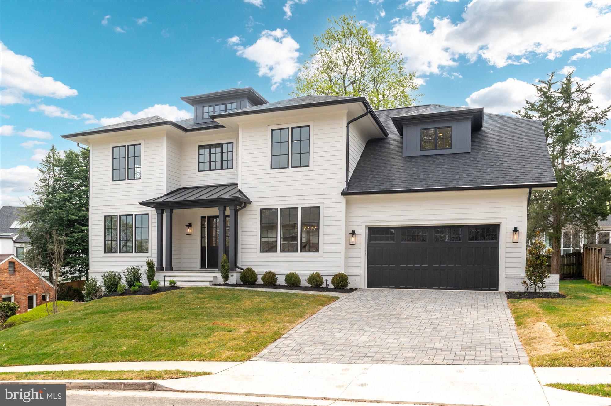 Finished and ready to move in! M-R Custom Homes presents this beautiful new custom home on a quiet street in North Arlington. This home features 6 bedrooms, 6 full bathrooms, and one powder room with 6,135 square feet of finished living space on three levels and beautiful seven-inch white oak hardwood floors throughout the main and upper levels. The main level includes 10ft ceilings, and a beautiful gourmet kitchen with custom inset maple cabinetry, 2.5" quartz countertops, 48" paneled Subzero refrigerator, 48" Wolf gas range, two paneled Bosch dishwashers, and a built-in Wolf microwave. The kitchen opens to spacious great room with coffered ceiling and a 42-inch ventless gas fireplace with tile surround, wood mantle, and flanking built-ins . Through the butler's pantry is an elegant formal dining room with abundant natural light. A large screened porch with heaters and speakers provides an amazing outdoor living space overlooking the backyard. A formal living room, en-suite bedroom/study, and a mud room with built-ins complete the main level living spaces. The upper level is highlighted by a luxurious primary suite with dual walk-in closets with built-ins, and a spa-like bathroom with heated floors, double vanities, stand-alone soaking tub, and heavy glass enclosed shower with a hand-held and rain shower head.  The walk-out lower level includes a spacious recreation room with a wet bar, an exercise room with rubber flooring and a bedroom with full bathroom. The 10,056 square foot lot is professionally landscaped with outdoor lighting and the back yard is nice and flat.  Convenient to Lee-Harrison Shopping Center, Washington Golf, and much more. Discovery ES/ Williamsburg MS/ Yorktown HS.