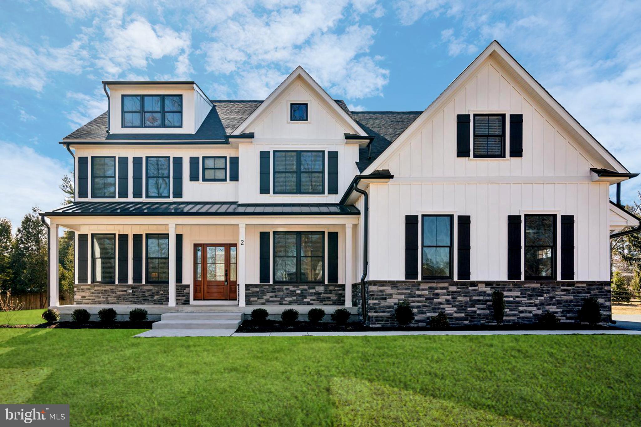 Who will be the lucky first owners of this stunning custom home?  This exquisite residence offers over 4,500 square feet of finished living space, nestled in a cul-de-sac, on a beautiful one-acre lot. From the moment you arrive, its curb appeal captivates, setting the tone for the elegance that awaits inside. Step onto the charming front porch, and make your way through the front door into a bright and welcoming foyer, where natural light pours in, highlighting the home’s impeccable craftsmanship. To the right, a formal dining room boasts custom wainscoting and a statement light fixture, creating the perfect ambiance for hosting unforgettable gatherings. To the left of the foyer, a versatile flex room with glass French doors offers endless possibilities—perfect as a home office, playroom, cozy den, or even a first-floor guest suite. Next to the flex space, you'll find a convenient half bathroom.  As you move deeper into the home, you’ll find the heart of the home—a spacious, open-concept living area that seamlessly blends the living room, informal dining area, and kitchen. The living room is anchored by a gas fireplace, adding warmth and ambiance. The kitchen is a chef’s dream, featuring custom white perimeter cabinets, white quartz countertops, and a farmhouse sink. The oversized island seats four and boasts black leathered countertops paired with custom white oak cabinetry. Completing this space is a high-end GE Café appliance package, including a 36” range. Just behind the kitchen, a huge walk-in pantry with a second refrigerator provides ample storage and prep space. Nearby, a butler’s pantry connects the kitchen to the living and dining areas, adding both function and charm. The mudroom offers convenient access to the oversized three-car garage, keeping daily life organized and clutter-free. A spacious covered deck extends seamlessly from the living area, creating the perfect indoor-outdoor flow. Whether you're hosting gatherings, enjoying a quiet morning coffee, or unwinding with a glass of wine in the evening, this space offers added comfort and versatility for relaxing or entertaining.  Upstairs, you'll find four generously sized bedrooms, each with custom closets. One bedroom features an en-suite full bath, while the second and third bedrooms share a Jack-and-Jill bathroom with dual sinks and a separate toilet and shower area for added privacy. The owner’s suite is a true retreat, showcasing a vaulted ceiling and a shiplap feature wall. The spa-like en-suite bathroom features a stand-up shower, separate soaking tub, a private water closet, and two huge linen closets. With more cabinetry and drawer space than most kitchens, storage will never be an issue. The expansive walk-in closet is divided into two sections—one of which is large enough to function as a small office or dressing area, while the other, complete with a window, makes for a perfect vanity space. For more added convenience, there is a large laundry room on the 2nd floor as well. The lower level offers both finished and unfinished spaces with high ceilings. The finished area includes a comfortable living space, a fifth bedroom, and another full bathroom, making it ideal for guests or extended family.

Just minutes from shopping, restaurants, nightlife, and scenic hiking trails, you'll never be short on things to do. The SEPTA train station is less than a mile away, and you’ll have easy access to Routes 309, 73, 76, 276, and 476, making commuting and travel a breeze. Located in Whitemarsh Township and part of the highly regarded Colonial School District, this home truly offers the best of suburban charm and urban accessibility.