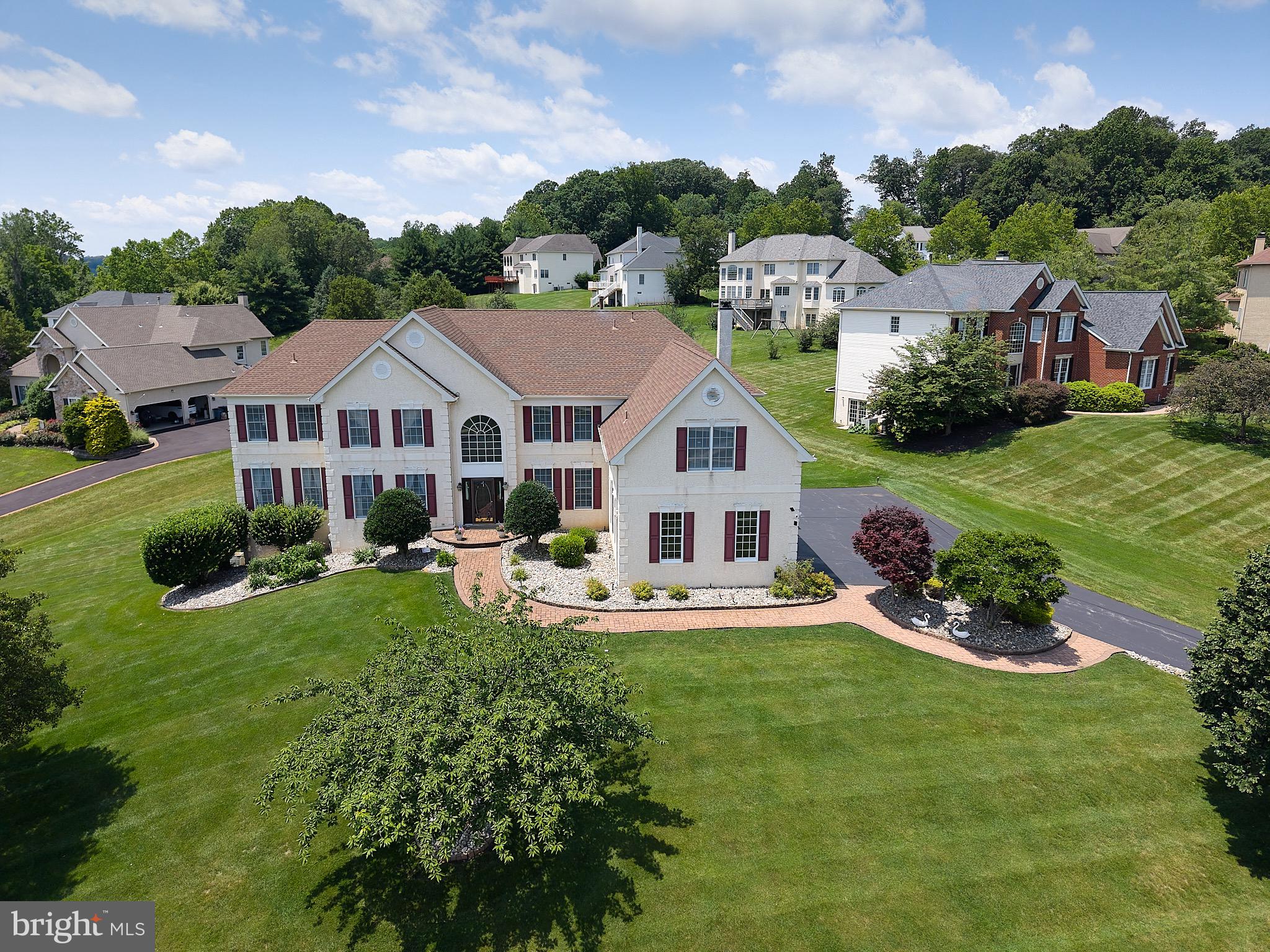 Coveted Swedesford Chase- this stately 6 bedroom/5.5 bath home is a rare offering in the highly sought after Swedesford Chase community in Exton, ideally located near premier shopping, dining, and major commuter routes- all within the award-winning West Chester Area School District. Perfectly designed for multigenerational living or flexible work from home needs, the main level features a private first floor en-suite with a full bath, walk-in closet, bedroom, and sitting area- ideal for an in-law, au pair, or dedicated workspace.   A grand two-story foyer with elegant millwork and a sweeping curved staircase is flanked by a private study and a spacious living room.  An open gracious dining room with dry bar and custom moldings is perfect for entertaining family and friends. The two-story family room with designer windows and a secondary staircase offers an airy inviting gathering space, flowing into the gourmet kitchen with abundant cabinetry, large pantry, granite countertops, update stainless Bosch appliances, and an OVERSIZED sunroom-WOW!  A mudroom provides direct access to the oversized three car garage. At days end, retreat to the spacious primary suite with sitting area, tray ceiling with fan, two walk in closets and a spa inspired oversized primary bath. Two additional large ensuite bedrooms (prince/princess suites) and two more oversized bedrooms connected by a Jack and Jill bath complete the upper level.  The full daylight walkout lower level is plumbed for a full bath and ready to be transformed- whether you envision a home theater, guest space with private entrance, or expansive recreational space. This exceptional home combines timeless elegance, thoughtful design, and a PREMIUM location. An uncommon opportunity in one of Exton's most prestigious neighborhoods.