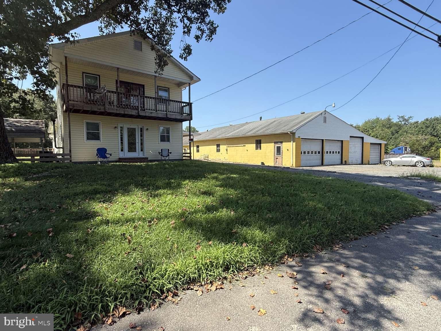 Significant price reduction for valuable C2 commercial zoning allows for many uses including car sales, car repair, construction yard, and more. 4.78 acres improved by a 2,031sf house and approximate 4k sf garage. 7 bay garage has four roll up doors: two 12'x8', one 10'x8', and one 8'x8'. One of the 12'x8' bays has car lift and pit. House has 3 bedrooms and 2 full baths. Situated 14 miles east of Fredericksburg in King George County, VA, off Rt 3 and Rt 301. Near Sheetz, Tractor Supply, Food Lion, YMCA, King George County High School, Government offices, Truist, Atlantic Union Bank, and more. Proof of funds required for showing. Serious inquires only.