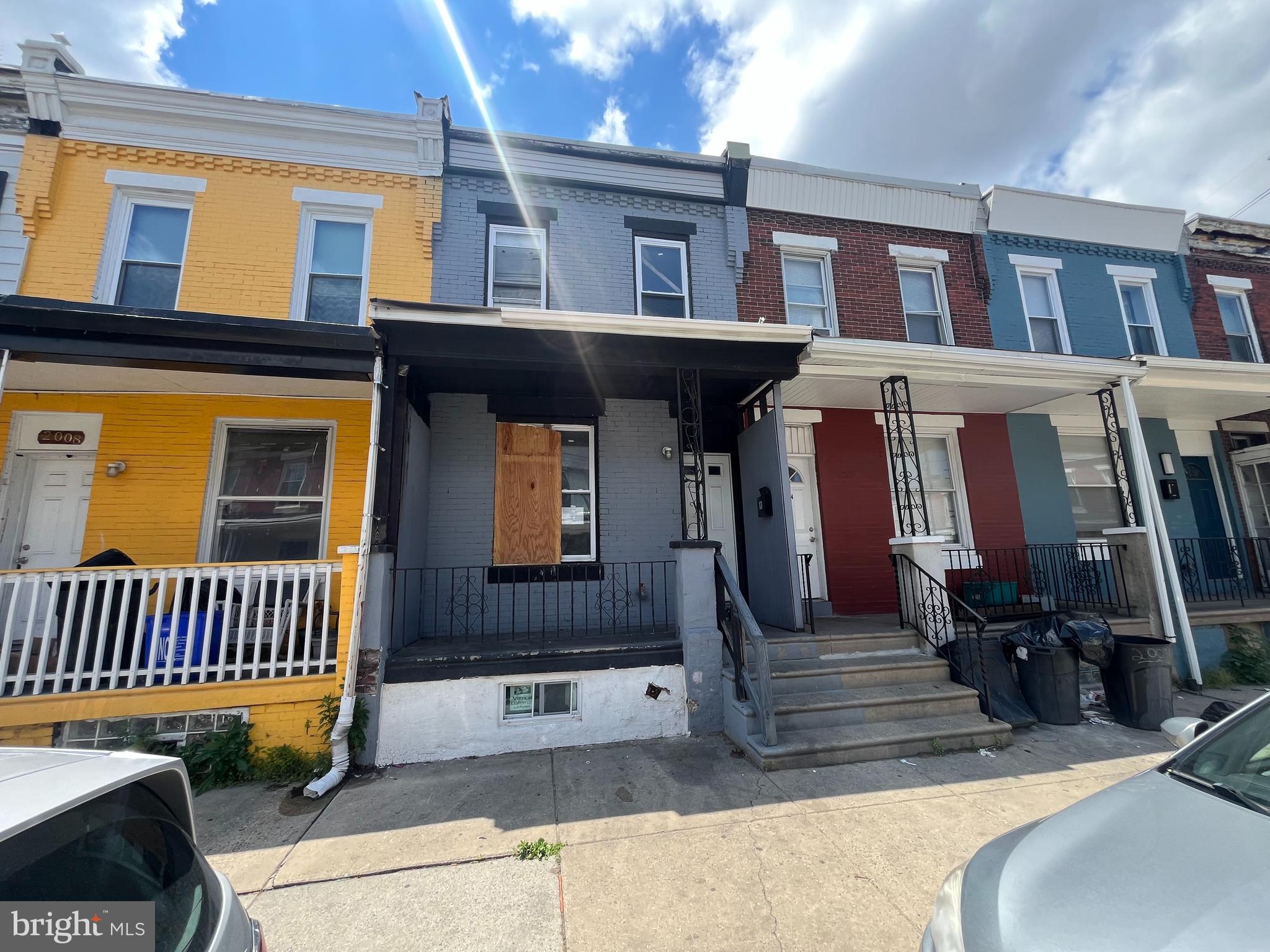 This is a two-story brick rowhome constructed circa 1920 and located in the Elmwood Park neighborhood of Southwest Philadelphia. The property features a traditional open front porch, rear yard, and full unfinished basement. It is configured as a duplex with two one-bedroom units, offering appeal to investor purchasers seeking rental income potential. The location provides convenient access to major transportation routes, along with walkable proximity to several public transit options.