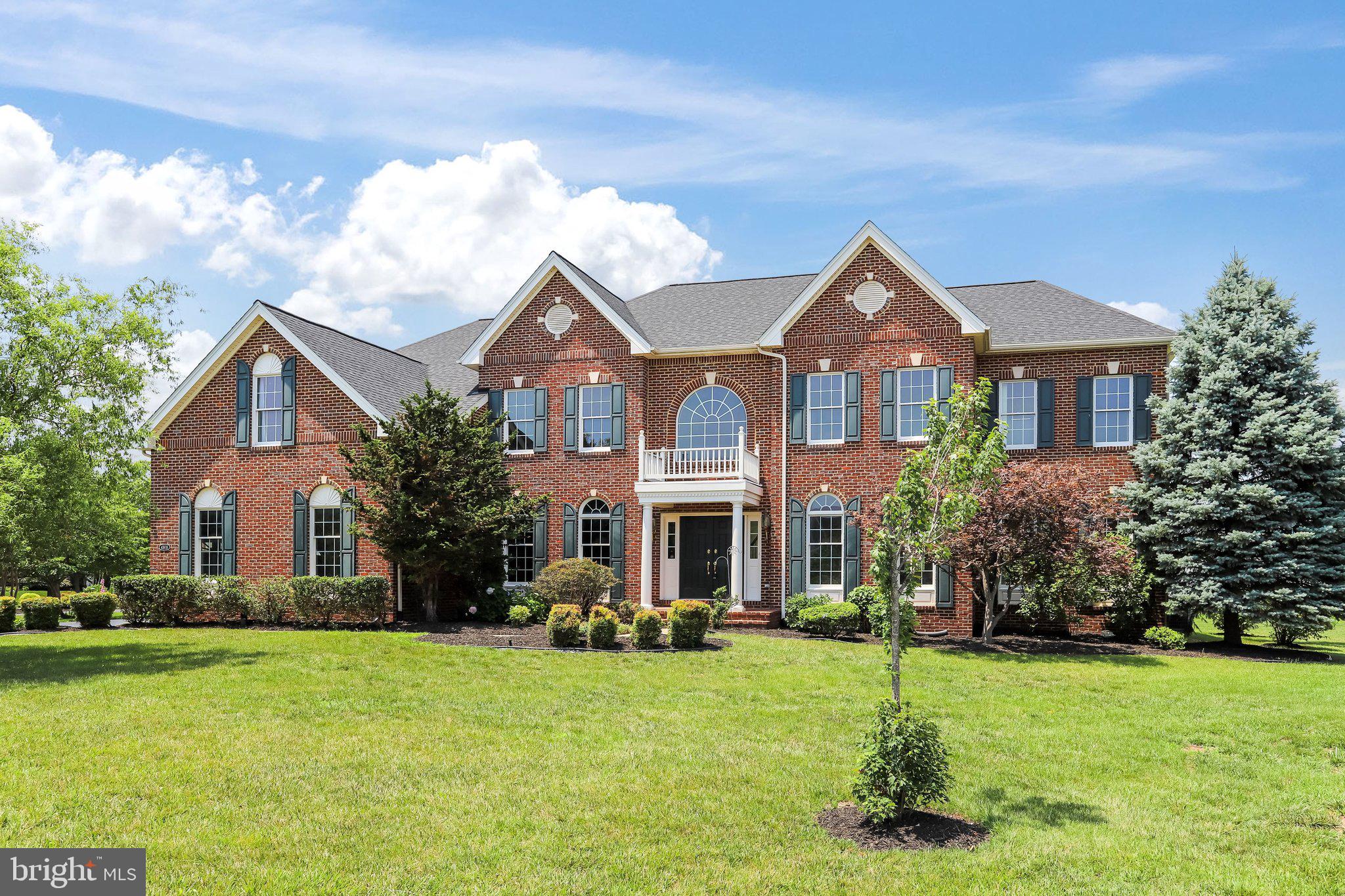 Beautiful brick-front Colonial in the highly sought-after Loudoun Valley Estates, offering 5 bedrooms, 4.5 bathrooms, and a 3-car garage. A grand two-story foyer with a sweeping curved staircase creates a stunning first impression, while gleaming hardwood floors flow throughout the main level. Thoughtfully designed for both everyday living and elegant entertaining, the home features spacious formal living and dining rooms, a dramatic two-story family room, and a sun-drenched sunroom that fills the home with abundant natural light. A private main-level office provides the perfect work-from-home space, while recessed lighting adds warmth and sophistication throughout.

The impressive two-story family room is anchored by a brick fireplace and expansive windows. Skylights with remote-controlled motorized blinds allow you to effortlessly adjust the natural light while enhancing comfort and energy efficiency.

The gourmet kitchen is beautifully appointed with granite countertops, a large center island, stainless steel appliances, and a bright breakfast area overlooking the backyard—ideal for casual dining and everyday gatherings.

Upstairs, the luxurious primary suite serves as a private retreat, featuring a tray ceiling, spacious sitting area, an oversized walk-in closet, and a spa-inspired bath with a soaking tub and separate shower. Bedrooms two and three each offer their own private en-suite bathrooms, while bedrooms four and five share a convenient Jack-and-Jill bath. 

The expansive unfinished walk-up basement provides endless possibilities to customize the space to your lifestyle—whether you envision a recreation room, home theater, fitness studio, guest suite, or additional living area—while still offering exceptional storage. French doors lead to the walk-up exit and a beautifully landscaped  backyard.

Outdoor living is equally inviting with a spacious composite deck overlooking open green space, complete with motorized retractable awnings for comfortable entertaining and relaxing throughout the seasons.

Recent updates include a new roof (2025) and new water heater (2026), offering added value and peace of mind.

Ideally located just minutes from the Silver Line Metro, shopping, dining, major commuter routes, and Washington Dulles International Airport, this exceptional home also provides convenient access to scenic walking and biking trails, parks, and top-rated Loudoun County schools.
