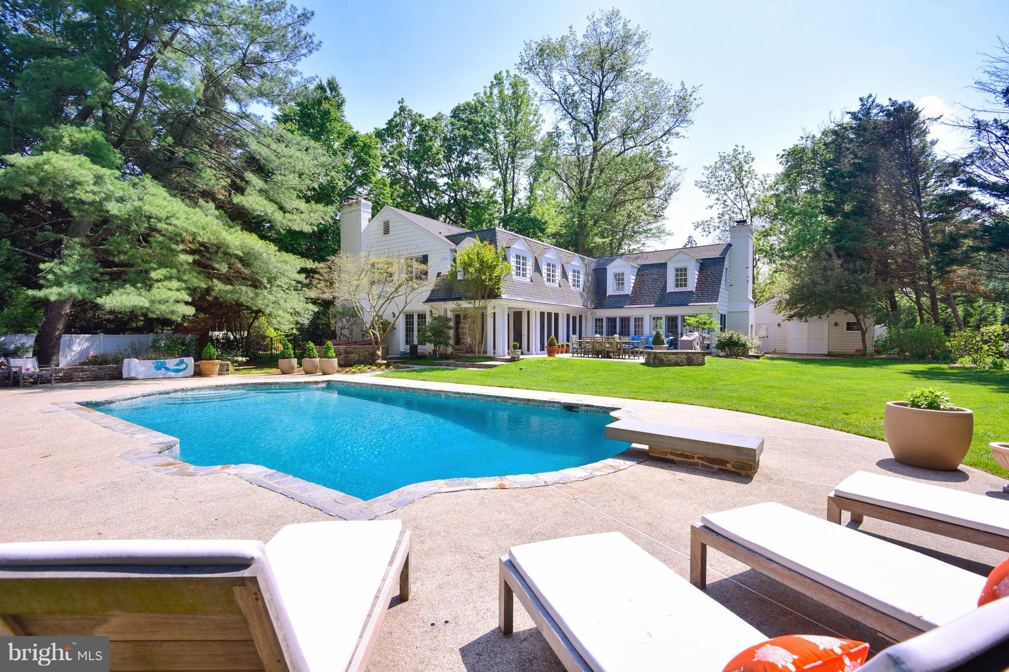 24 hour notice to show. Feel the peace of being in the country just blocks off of the Charles St corridor in this elegant 5 BR  home recently remodeled by one of Baltimore's finest builders.  High end finishes thruout, exquisite kitchen, large attached family room, mudroom screened porch, sun room, LR, DR, and huge finished basement. Pool house and hot tub surrounded by gorgeous patio & gardens.