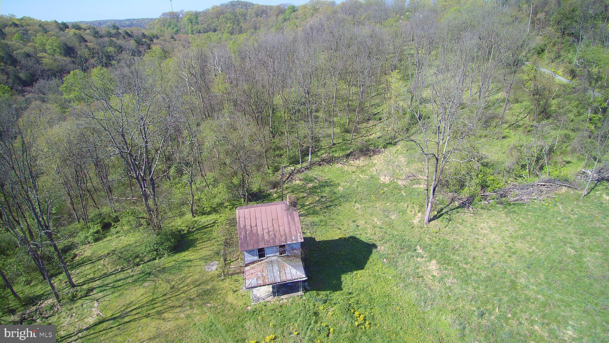 Rare opportunity to find 189 acres all adjoining, 124 acres wooded with Cocolamus creek- well stocked Trout Stream- flowing through a portion of the eastern end of the property, in Greenwood Township, Perry County.  Timbered in the 1960's, facing the northern side, you will be sure to find enough timber to build your own log home. While 64.7 acres is in the Millerstown Boro mostly pasture great for organic farming and has never been sprayed, public sewer and public water close by but unknown of capacity. Land is in clean and green since late 1990's. Old farmhouse on the open field portion with a well and septic on site but statis is unknown and hasn't been lived in for over 40 years. Great for a future development or build your dream home far away from the rest of the planet, enough room to even have your own runway for your own jet. Oh what money can buy? No drive Bys so call your favorite agent and pack up your gator today for a private tour.