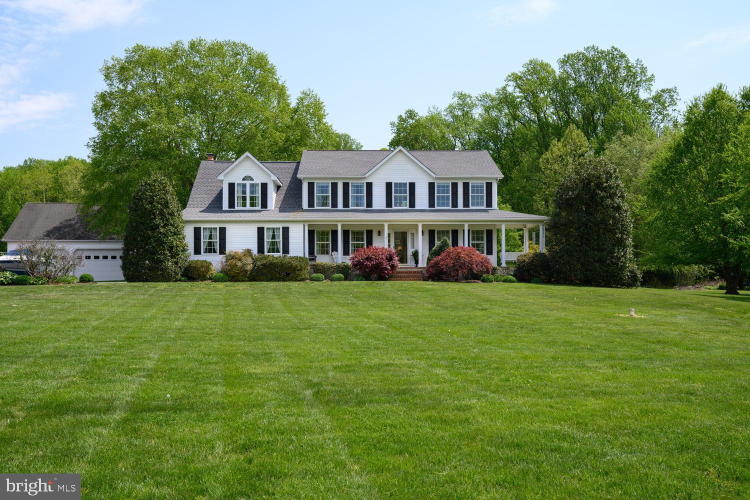 Welcome to 127 Pleasant Springs Drive, a beautifully maintained home nestled in the highly desirable Claiborne Fields community of Centreville. 
This four‑bedroom, 3.5‑bath residence offers the perfect blend of comfort, style, and functionality—truly an ideal place to call home.
Set on 4.0 picturesque acres, the property includes 2.1 acres owned plus an additional 1.937 acres under a 99‑year lease, with an invisible dog fence already in place. A welcoming front porch overlooks a freshly manicured, park‑like landscape featuring perennial gardens, a dedicated herb garden, and a full fruit orchard, creating a serene and private setting.
Designed for both relaxing and entertaining, the home offers a screened porch perfect for summer gatherings, along with a private hot tub for year‑round enjoyment. Inside, the main living areas flow seamlessly. The well‑appointed kitchen features generous cabinetry and workspace and opens to the dining area and family room, complete with custom built‑ins and a cozy fireplace. A separate office or playroom adds valuable flexibility for today’s lifestyle.
The spacious primary suite is a true retreat, offering ample closet space and a spa‑like ensuite bath with a jetted tub, walk‑in shower, and double vanity. Additional bedrooms provide comfort and privacy for family and guests alike.
The partially finished basement includes a full bathroom, separate exterior entrance with stairwell, and a full bathroom, creating excellent potential for an in‑law suite, guest space, or recreation area. A detached four‑car garage provides abundant storage and versatility.
Buy with confidence knowing the home features a newer roof, water heater, water tank, and updated appliances. Outdoor spaces are thoughtfully designed for low‑maintenance enjoyment—perfect for morning coffee or evening relaxation.
Claiborne Fields is known for its peaceful atmosphere, expansive one‑plus‑acre lots, and convenient proximity to downtown Centreville, shopping, dining, parks, and major commuter routes.
This exceptional home offers comfort, privacy, and community in one of Queen Anne’s County’s most sought‑after neighborhoods. Schedule your private tour today—you won’t want to miss it.