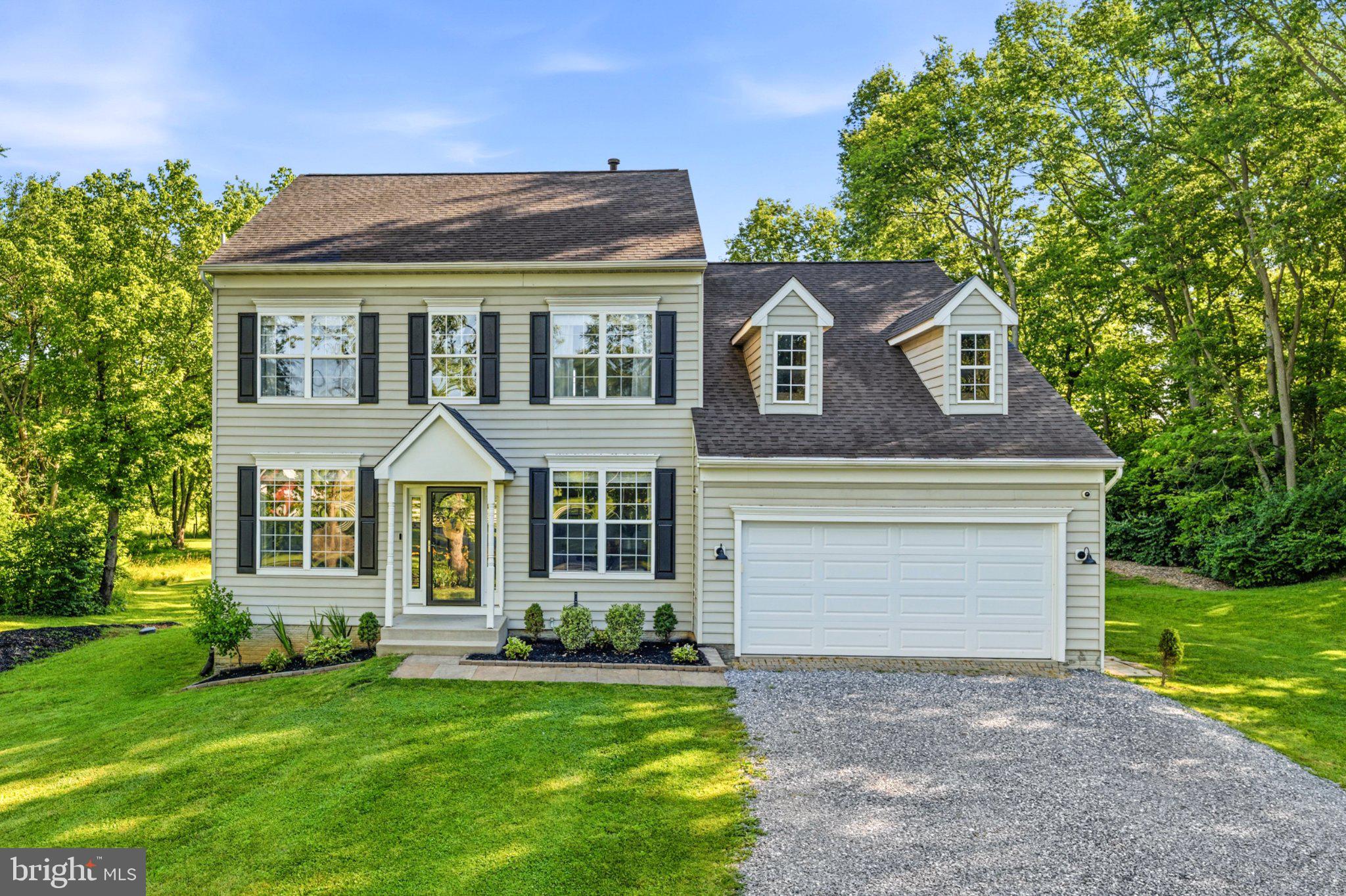 You'll know before you reach the front door.

8494 Devon Lane is 4 bedrooms, 2.5 bathrooms, and 3.34 private acres in Frederick County — no HOA, no compromises, and the kind of quiet that people drive an hour to find. The current owners purchased this home and treated it the way a forever home deserves to be treated.

Step inside and you’ll find luxury vinyl plank runs continuously throughout the entire home now, from the foyer and open-concept dining/bonus living room — it’s clean, cohesive, and built for real life. The five year-old kitchen is a timeless showstopper: custom white cabinetry reaching 9-foot ceilings, a massive contrasting island with built-in microwave nook and double trash drawer, quartz countertops, tile backsplash from counter to ceiling, and stainless steel appliances. The family room opens off of the kitchen with oversized windows and a propane fireplace. Down the hall, a private office with French doors and a discreet half bath round out the main floor.

Upstairs, three secondary bedrooms share a beautifully renovated full bath with wood-look ceramic tile, a new tub and shower surround, and updated fixtures throughout. The owner's suite — cathedral ceiling, double doors, two walk-in closets — anchors the floor with a primary en-suite featuring an oversized herringbone-tiled shower, penny tile floor, built-in quartz seat, and added storage. Every detail considered. Nothing left undone.

The unfinished English basement spans the full footprint of the house: currently a gym and storage space, but ready with rough-in plumbing to become whatever you need it to be to see your value skyrocket.

Outside is where this property really separates itself. The owners opened up the yard with extensive landscaping updates, pulling back the tree line to give you more usable space while maintaining the natural buffer around the property. Thirty tons of fresh 57 stone went into the driveway — it handles a crowd, a truck, a trailer, or a Tuesday. The paver patio runs the full width of the back of the house. There's room for bonfires, cookouts, a garden, and kids running laps until dinner. The chicken coop is ready and waiting.

Woodland preservation easements along both sides of the property mean the privacy is permanent — not just a feature of this moment, but of every season you'll spend here.

Under the surface, the current owners did the unglamorous work too: septic properly maintained, water filtration fully overhauled with a new softener, sediment filter, reverse osmosis system, and UV light treatment. The infrastructure matches the aesthetics.

This is a home that's been loved, maintained, and upgraded with intention. It's ten minutes from dining, shopping, schools, and everyday life, and a world away from everything that wears you down.

If you've been waiting for a place to put down real roots — this is it.