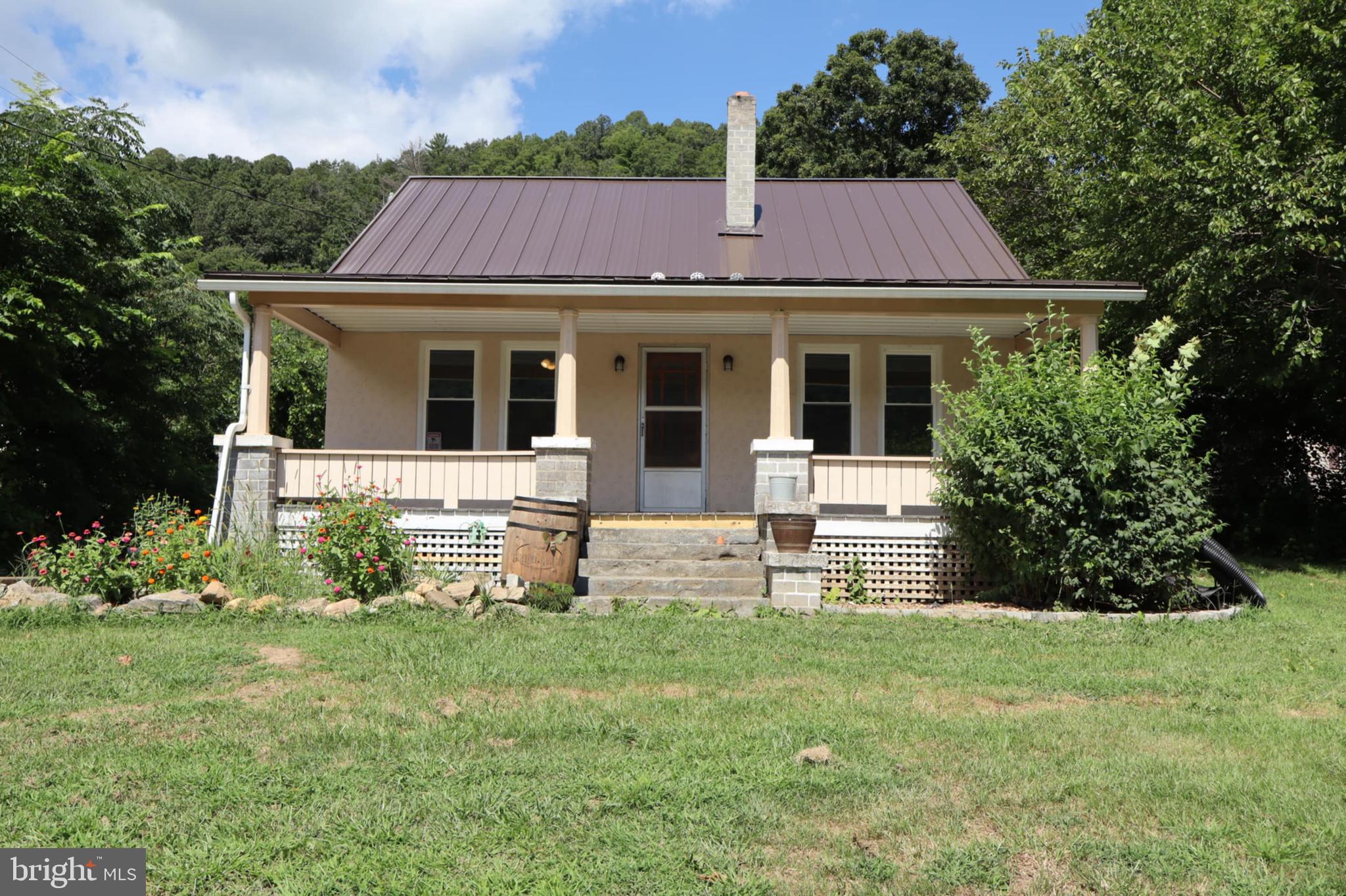 **Price Improvement & Now Offering a $5,000 Seller Credit** 
This charming 4 bedroom, 2 bathroom turn key Craftsman-styled home is just what you've been searching for. This home has been completely renovated so you don't have to do all the hard work. Recent updates: New Gravel Driveway, New Windows, Refinished hardwoods, New LVP Flooring, New Appliances, New Metal Roof(2023), New Gutters(2024), New Electric HVAC System,(2025). Complete with laundry room/pantry, Sunroom off the back and a walk out basement, this home is sure to check all those boxes! Fresh landscape will be complete prior to purchase.