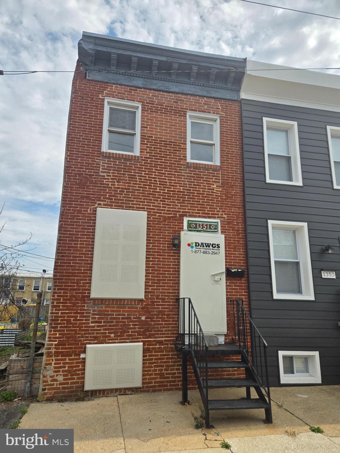 Great location for this spacious three bedroom end unit townhome. Located close to downtown, inner harbor, the stadiums and the University. Bring this former beauty back. Unfinished basement. Huge backyard. Next to the neighborhood produce garden to grow your own produce.