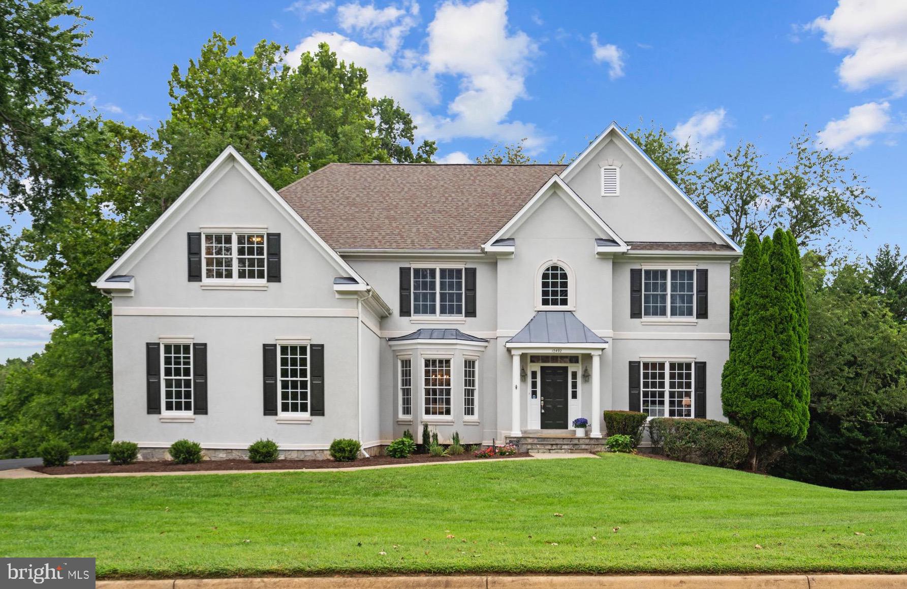 OPEN HOUSE SUNDAY 9/7 12-2.  Welcome to 10492 Hunting Hills Place, where timeless architecture meets modern updates. Set on a pastoral 1.01-acre lot, this stately 5-bedroom, 4.5-bath Colonial offers fresh, move-in-ready spaces and an unbeatable location close to Tysons, DC, Dulles Airport, and the Vienna Metro.
Step inside to find a bright, open floor plan with brand-new hardwoods on the main level, freshly painted interiors, and a soft, neutral palette that complements the natural light flooding every room.
The main level is designed for flexibility, featuring a formal living room, dining room with elegant wainscoting, and a private office (or 5th bedroom) with an adjacent half bath — ready to convert to a full bath if desired. The heart of the home is the two-story great room, where a soaring stone fireplace creates a dramatic focal point, and the refreshed kitchen shines with refaced cabinetry, granite counters, stainless steel appliances, and a center island perfect for casual meals.
Upstairs, the spacious primary suite offers a sitting area, a walk-in closet plus two double-door closets, and a large ensuite bath with a soaking tub and separate shower  in pristine condition for immediate use or for a future remodel. Three additional bedrooms (one w/private full bath)  and a full hall bath complete the upper level. 
The walk-out lower level expands the living space with a huge recreation room, a full bath, and three large storage rooms ideal for a gym, workshop, or future guest suite.
Outside, the freshly painted deck overlooks a peaceful, level backyard framed by mature trees. Perfect for entertaining or enjoying the serene setting. Thoughtful landscaping enhances curb appeal while maintaining a low-maintenance profile.
All this in a quiet, established neighborhood with easy access to commuter routes, shopping, and dining. Enjoy being minutes from Vienna Metro, Tysons Corner, Mosaic District, downtown Vienna, and major routes (I-66, Route 123, and Route 50).
This is Oakton living at its best - updated, elegant, and ready for you to make it your own.
