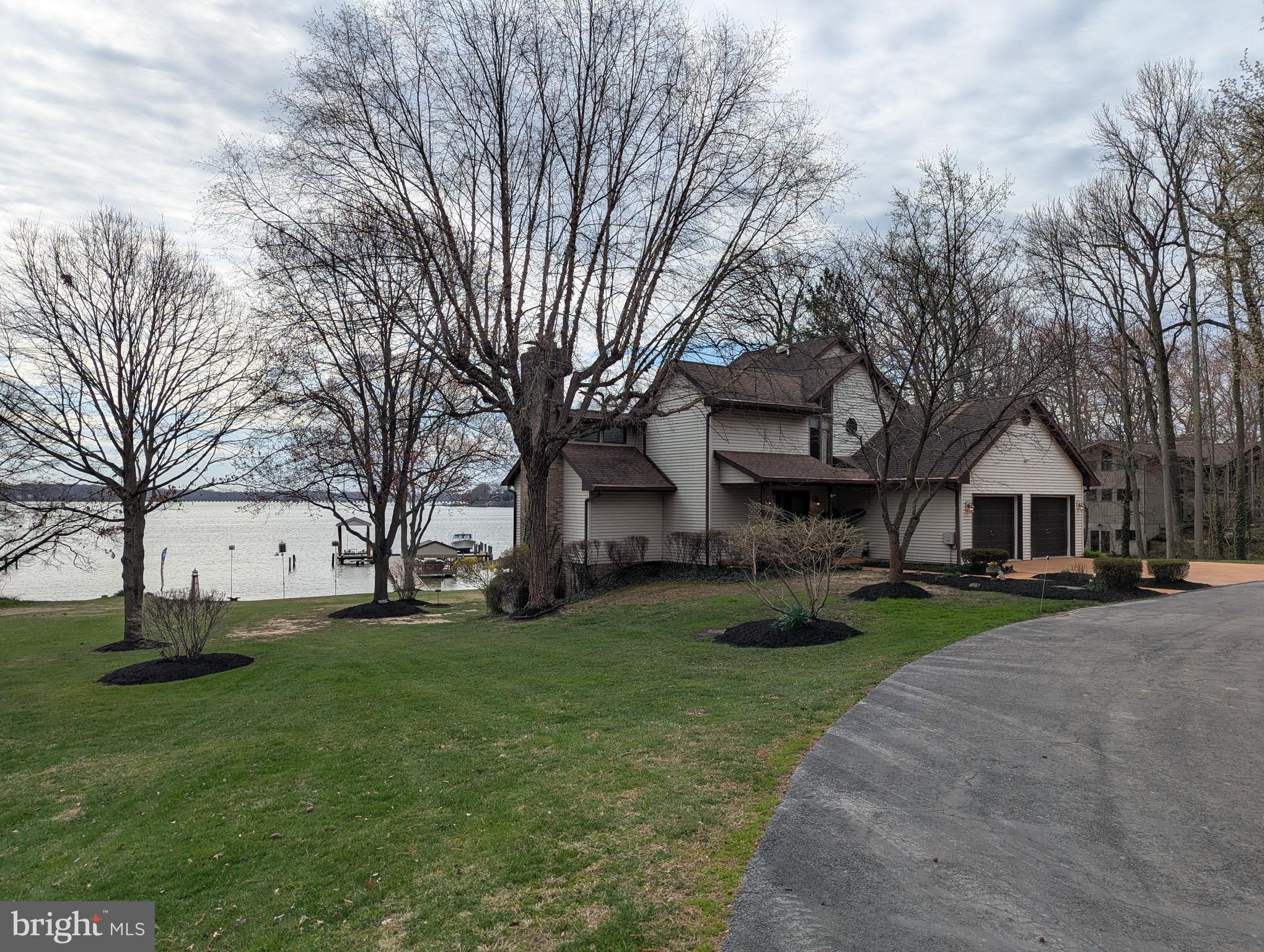 $750,000.00 LIST PRICE SUGGESTED OPENING BID AT AUCTION. ****NO PRE BID****
 AUCTION Friday May 1st, 2026 @ 11:00 AM ON PREMISES. Broker/agent registration form is available upon request and must be in the hands of Jay Edwards Auctioneers 48 hours prior to the auction.

LG. WATERFRONT PROPERTY/ 2-STORY CONTEMP. HOME
W/ ATT. 2-CAR GARAGE and CLEAN 1-BR COTTAGE HOME

(4) PARCELS TOTALING 3.35 +/- ACRES

SOLD IN THE ENTIRETY

155 +/- FT FRONTAGE ON BUSH RIVER W/ SANDY BEACH
LARGE DOCK W/ (10) +/- BOAT SLIPS, & TIKI BAR
12’x32’ BATH HOUSE/15’x28’ FRAME BOAT HOUSE W/ 5-T LIFT
32’x50’ STEEL POLE BARN BLDG./ DET. 22’x16’ BLK. GARAGE

Main House- Enter from front entrance to foyer w/ ceramic tile. LR
w/ stone fireplace & gas (propane) fireplace insert. Digital thermostat. DR area w/
slider door exit to main level deck w/ awning overlooking the river. Country
kitchen has dining area, dual sink, center island, refrigerator, dishwasher, Jenn Aire
electric stove top, built-in microwave, Jenn Aire oven, tile back splash, & pantry.
Hallway coat closet. First floor bath. Exit to attached garage. Walk upstairs to
second floor landing. Primary BR w/ ceiling fan. Sliders exit to BR deck w/
awning. Primary bath w/ Jacuzzi tub, sink, separate shower, & toilet. Large
apartment style washer & dryer. BR #2 or office space w/ attic pull-down & eaves
storage/ closet space. Walk down to lower level to utility room. Family room has a
ceiling fan, brick fireplace w/gas insert, wet bar, & slider door exit to waterfront.
Additional laundry area. BRs #3 & 4, each w/ ceiling fans & slider door exits to
waterfront. Electric heating & air (approx. 1 year old). Upper level has separate
heating & air zone. Generac whole house generator. Public water & private sewer.
Large fishpond w/ bridge between main house & cottage.
1-Level Cottage- Enter from front entrance to kitchen w/ gas stove, refrigerator, &
dishwasher. LR. BR. Full bath. Washer & dryer. Separate septic & water hook-up.
12’ x 32’ Bath House- Enter from side to kitchenette w/ sink & refrigerator.
Lounging/changing area. Bar. Screened in porch area. Electric, lighting, & water.
Outside ladies & men’s portable restrooms.
Dock- w/ electric & water, (10) additional boat slips, 5-ton lift under 15’ x 28’
frame boat house, tiki bar (located on dock), & (2) jet ski lifts.
Additional Improvements: 12’ x 15’ storage building w/ electric & lighting, 18’ x
12’ storage building w/ electric & lighting, 10’ x 12’ Shed, 22’ x 16’ block garage
w/ electric & lighting, 32’ x 50’ steel pole barn building w/ commercial height
automatic doors, awning, electric, lighting, water, & loft area.