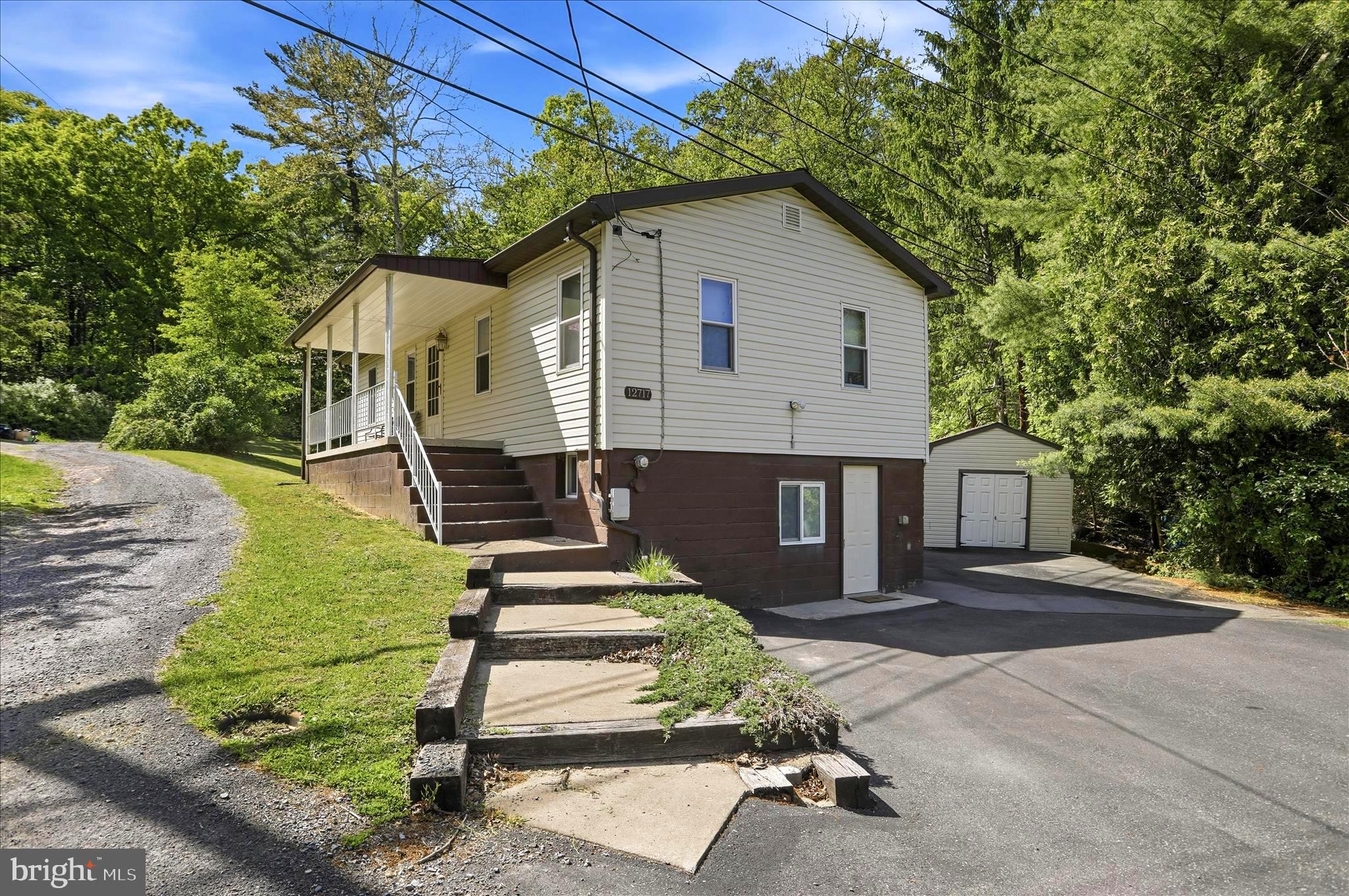 Don’t miss this once-in-a-lifetime chance to own a move in ready home with over 90 acres on Haystack Mountain in the desirable Bowling Green area. Located just three minutes outside city limits, with NO CITY TAXES, this property offers the perfect balance of privacy and convenience by giving you a big country feel that is only minutes from I-68, LaVale, and Cumberland, or an easy commute to Northrop Grumman. The property features a 4-bedroom, 2-bath home with a paved driveway, an inground pool, and a pool house. The main level includes 3 bedrooms and 2 full bathrooms, including a spacious primary bedroom and recently renovated primary bathroom. The basement includes 1 bedroom that has been completely remodeled a few months ago. The home has also undergone extensive professional improvements to the drainage system and basement, giving peace of mind to future owners and adding long-term value. In addition to a brand NEW architectural shingle roof that was completed in May 2026 . Step outside and explore everything this land has to offer, including some of the best year around hunting in Allegany County: Over 90 acres of usable land, a rare natural spring on the property, a custom hunting shack with scenic views, ATV/side-by-side trails throughout, frequent animal sightings (deer, bear, coyotes, and turkeys), and potential build sites for an additional, future home. Whether you’re looking to build, invest, or enjoy outdoor living, this property offers unmatched flexibility. Live in the existing home while building your custom home in the woods, then rent or sell the original house—the possibilities are endless. Utilities are available at the road, making future development even more accessible. Imagine mornings with coffee overlooking the mountains, afternoons exploring your own trails, and evenings under the stars—this is more than a home, it’s a lifestyle. If you’ve been searching for space, privacy, and potential all in one property, this is it!