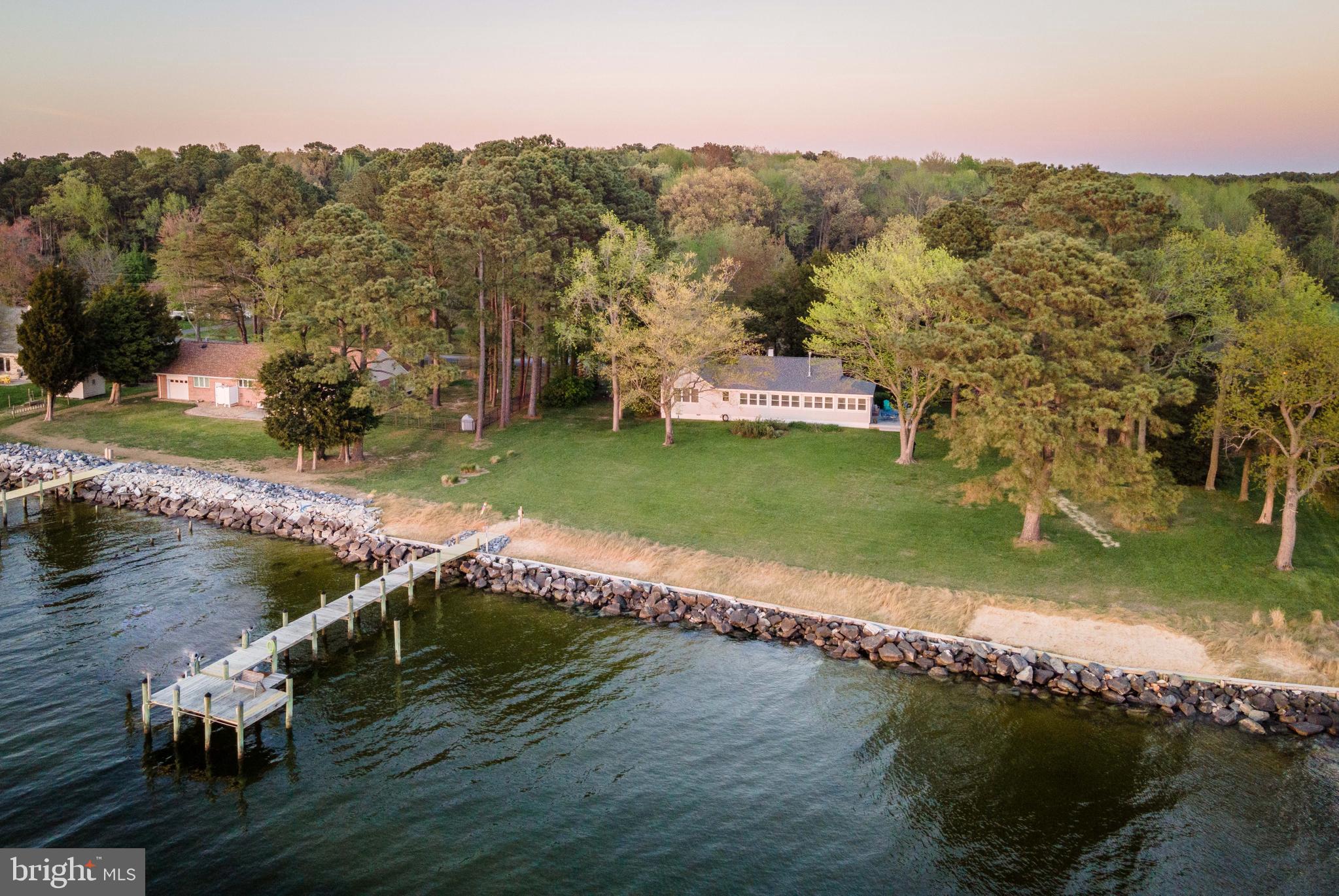 Charming waterfront cottage on the Potomac river with gorgeous sunset views!  Luxury vinyl plank flooring in main living areas.  Sunroom makes a great space for dining and is also large enough for a day bed for extra sleeping spaces.  Gas cooking, heat and fireplace.  Large master bedroom.  Attic area is floored Two decks for cookouts.  Beautiful lot.  Rip rap, pier has water & electric.  Garage is used more for storage, workshop & utility area.  Enjoy boating, fishing crabbing & swimming  on the river.  Close to restaurants & Piney point lighthouse museum.