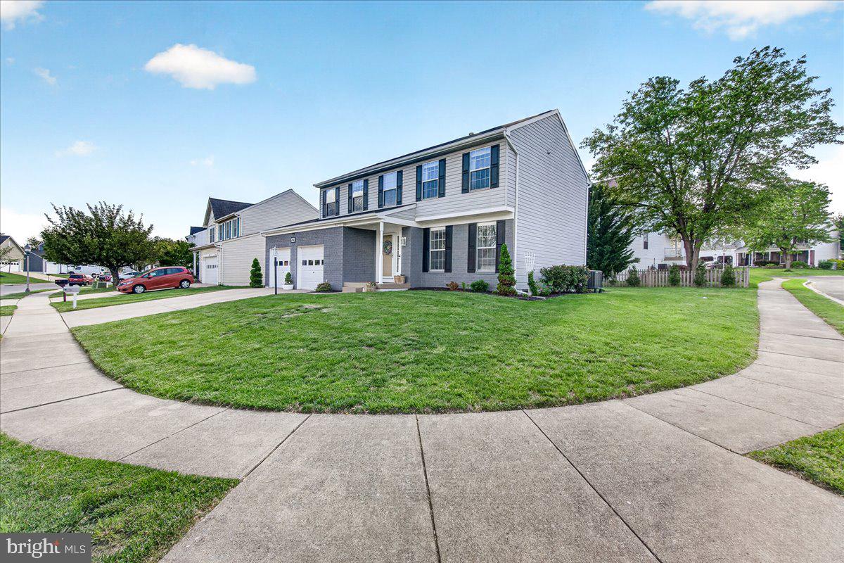Welcome to 701 Angelwing Lane, a beautifully maintained home in the highly sought-after Monarch Ridge community, offering the perfect blend of space, comfort, and convenience. Situated on a desirable side lot with impressive curb appeal, a spacious backyard, and over 2,700 square feet of finished living space, this elegant residence is designed for both everyday living and entertaining.
Step inside to bright, airy interiors featuring beautiful hardwood flooring throughout the main living areas, along with elegant crown molding and decorative wall wainscoting that add timeless character and architectural charm throughout many of the living spaces and rooms. Professionally interior-designed spaces create a warm, elevated atmosphere complemented by dimmable recessed and decorative lighting throughout the home.
The thoughtfully designed floor plan offers 4 bedrooms, 3 full baths, and 1 half bath. At the heart of the home is a kitchen featuring stainless steel appliances, upper/lower cabinetry, storage closet, and abundant natural light. The kitchen seamlessly opens to a spacious living area centered around a cozy gas fireplace, creating an inviting space. There is a charming breakfast area with walkout access to the ground-level patio — perfect for outdoor dining, relaxing, or hosting guests.
Upstairs, you’ll find four spacious bedrooms, including a luxurious owner’s suite complete with an oversized walk-in closet, a vaulted ceiling, and a spa-like ensuite bath featuring double vanities, an updated walk-in shower, built-in cabinetry, and upper-level laundry adds everyday functionality and ease.
The fully finished lower level provides exceptional additional living space with two large recreation areas, a wet bar, a full bath, and walk-up access to the backyard — ideal for entertaining, guests, a home office, gym, storage, or flexible multi-purpose living.
Additional updates include a completely new HVAC system installed in 2022, offering added peace of mind and energy efficiency. An attached two-car garage provides added convenience and extra storage space.
Ideally located off of Route 40, adjacent to Butterfly Ridge Elementary, parks, shopping, dining, and major commuter routes, this home delivers the lifestyle you’ve been searching for. Don’t miss your opportunity to call 701 Angelwing Lane home!