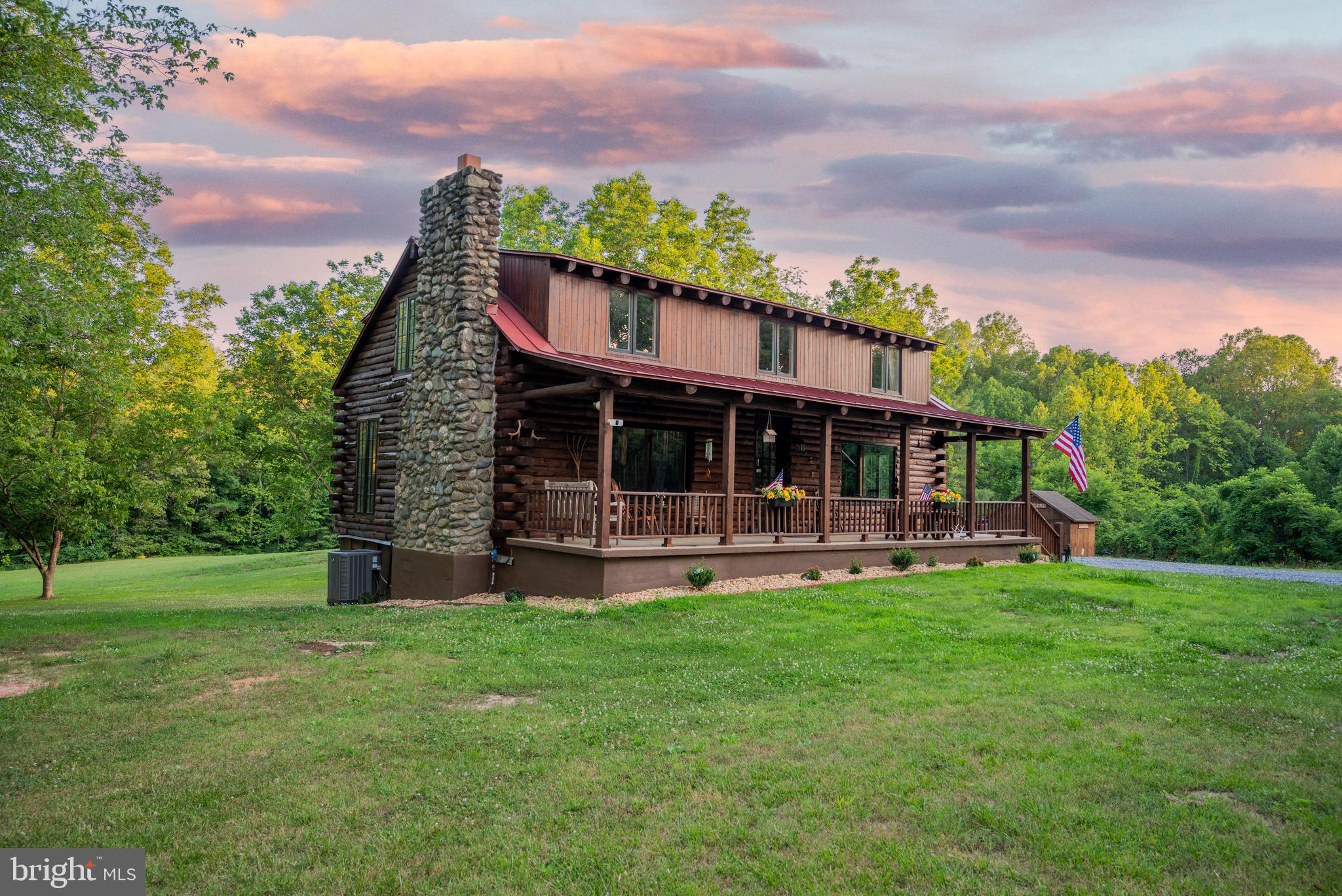 Welcome to your own private retreat in the beautiful countryside of Orange County. Set on 31.87± secluded acres, this log home offers the perfect blend of comfortable living and outstanding recreational opportunities, all while being conveniently located just minutes from US-522 and within easy reach of Lake Anna, making it an ideal full-time residence, weekend getaway, or hunting retreat.

The 1,920-square-foot home features 3 bedrooms and 2 full bathrooms and has been thoughtfully updated by the current owners. Recent improvements include a new roof, all-new appliances, updated fixtures, and stylish finishes throughout, creating a move-in-ready home that perfectly blends rustic charm with modern conveniences. The open and inviting living spaces make it easy to feel at home from the moment you walk through the door.

Beyond the home, the property truly shines. Multiple outbuildings provide excellent space for storing equipment, ATVs, tools, hunting gear, firewood, and more, adding both convenience and functionality to the property. A well-established trail system winds throughout the landscape and is wide enough to navigate by truck, ATV, or side-by-side, providing easy access to nearly every corner of the property. Multiple natural springs and a small pond provide a reliable, year-round water source for the abundant wildlife that call the property home, further enhancing its exceptional recreational appeal. Whether you're exploring the woods, checking trail cameras, hauling firewood, or heading to your favorite hunting spot, the trail system makes enjoying and managing the land effortless. The heavily wooded landscape offers outstanding privacy, abundant wildlife, and endless opportunities for hunting, hiking, recreation, and making memories outdoors.

Despite its peaceful, secluded setting, the property offers exceptional convenience with easy access to US-522 and is just a short drive from the towns of Orange, Gordonsville, and Louisa, as well as the recreational opportunities of Lake Anna. Enjoy the privacy of country living without sacrificing convenient access to shopping, dining, boating, fishing, and everyday amenities.

If you've been searching for a private home on acreage with exceptional recreational potential, meaningful updates, complete seclusion, and a convenient location, this one deserves a spot at the top of your list.
