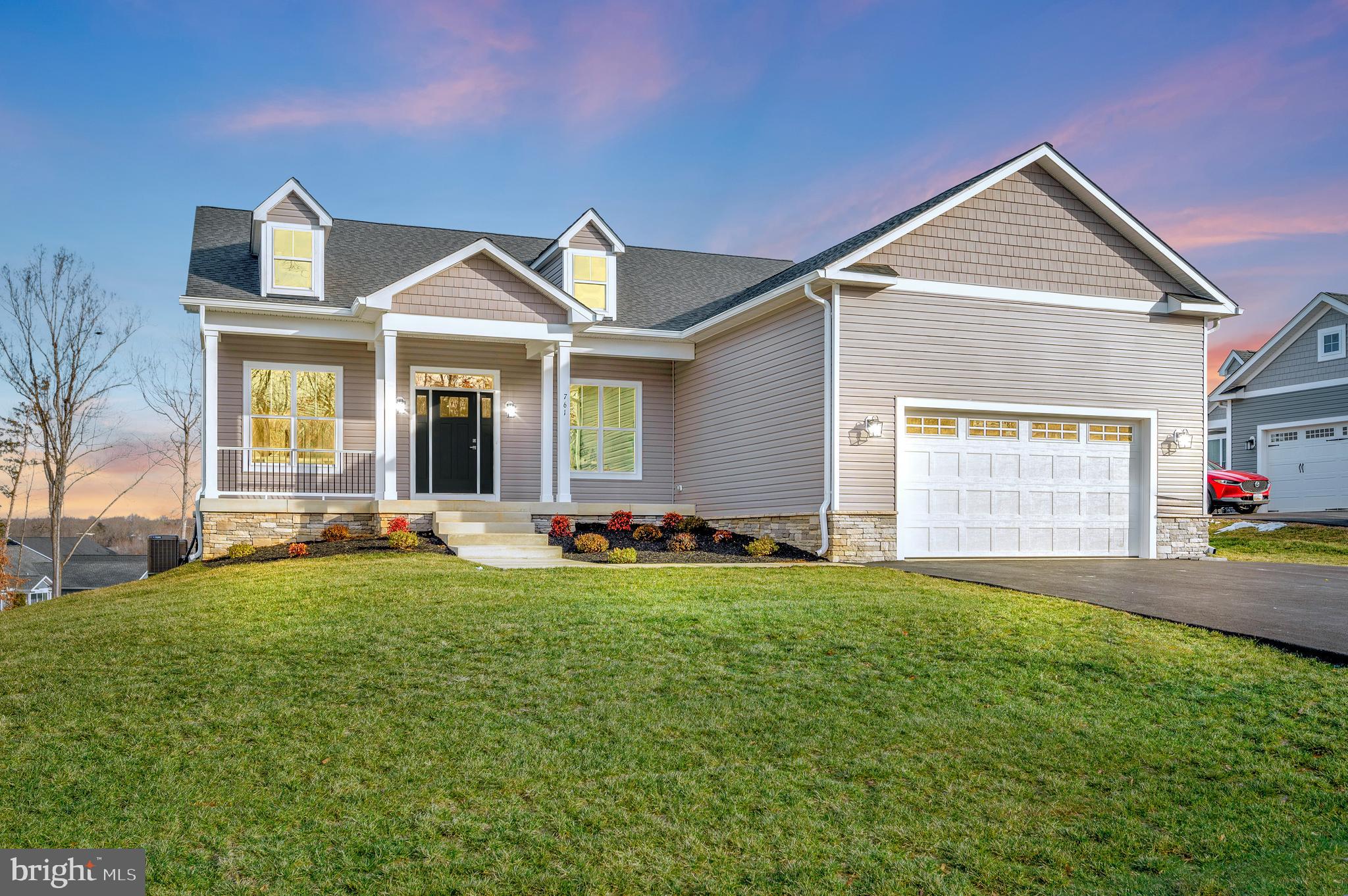 Private showing available with 20 minutes notice all weekend

DO NOT MISS THE INTERACTIVE TOUR
Experience lake life at its best with this stunning new construction by Larson Custom Homes, located in Sunset Cove, Lake Anna’s only planned community in Lake Anna. Located on the public side of the lake. This beautifully designed, decorated model home offers upscale finishes and a low-maintenance lifestyle, perfect for those seeking both comfort and convenience. Sunset Cove’s exclusive amenities include lawn care, a community pool, a clubhouse with live entertainment and beer on tap, a fully equipped gym, and a covered boathouse. Outdoor enthusiasts will appreciate the walking paths, Frisbee golf course, pickle-ball, tennis, and basketball courts.

This exceptional home features GE Café appliances, luxury vinyl flooring throughout, upgraded cabinets, and quartz countertops. Designed with efficiency and comfort in mind, it includes a two-zone heating system with dual-fuel capability, ensuring year-round climate control. Outdoor spaces abound, with a paved driveway, full-sized patio, expansive covered porch, and sun deck—all offering breathtaking views of Lake Anna from one of the community’s highest elevations.

Inside, the main level boasts a private owner’s suite with dual sinks, a freestanding soaking tub, a water closet, and an oversized walk-in shower with frameless glass and tile to the ceiling.  A home office and a third bedroom with an ensuite bath are located near the front of the home, while the 14-foot ceilings in the open-concept family room and dining area create a spacious, airy atmosphere. The family room features a custom fireplace and access to the covered porch, perfect for entertaining or relaxing.  A private guest suite with a full bath, along with a mudroom, large pantry, and additional storage closet, complete the main level.

The fully finished lower level includes a bonus/sewing room, a large bedroom, a full bath, and an expansive rec room with plenty of storage. The home is equipped with thoughtful features such as an electric car rough-in, a continuous water pressure system, additional hose bibs, upper and lower cabinet lighting, recessed lights, ceiling fans, and a comprehensive lighting package. The large garage includes decorative windows and a service door, while the established sod lawn and covered front porch add curb appeal.

Larson Custom Homes also offers additional options for homesites in Sunset Cove, including customizable 3-level homes with a variety of color and finish choices available for Fall 2025. Don't miss your chance to live in this vibrant lakefront community!