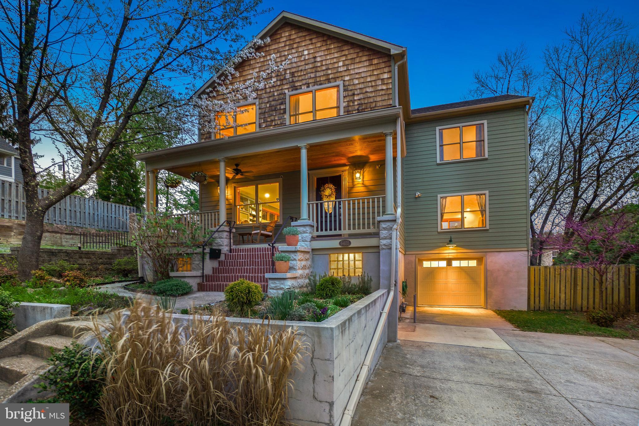 Make sure to check out our 3D Virtual Tour! Welcome to this stunning contemporary Craftsman Colonial. With a picturesque covered front porch to greet you, this exceptional home seamlessly blends comfort, design, and an abundance of elegantly presented spaces - room for all your pursuits! All under a mile from the Takoma Metro Station, and with even closer proximity to nearly every amenity in town, this home offers an unbeatable location paired with a spectacular, light-filled interior.

Natural light, handsome wood trim and millwork, recessed LED lighting, Pella windows, and gorgeous wood flooring create a warm and inviting atmosphere. The open-concept main level is designed for both everyday living and entertaining. The living room features a gas log fireplace flanked by built-in display shelving. The large dining area is adjacent, complete with a stylish bar, wine rack, and a striking spoked chandelier. The chef’s kitchen flows seamlessly into the spacious family room with custom built-ins and sliding glass doors leading to the rear deck. The kitchen is a dream, featuring stainless steel appliances, a five-burner gas range, stunning solid-surface countertops, rich hickory cabinetry, a wine refrigerator, pendant and recessed lighting, and an expansive prep area. A magnificent red pine staircase and a powder room complete the main level.

Upstairs, four spacious bedrooms include a luxurious primary suite with a private balcony overlooking the tiered backyard, two walk-in closets, and a spa-like en-suite bathroom. The primary bath, accessed through a beautiful pine barn door, offers a glass-enclosed shower, a jetted soaking tub, bidet, and two separate vanities. This level also features a hall bathroom, a convenient laundry closet, and a deep linen closet.
The lower level provides even more living space, including a mudroom area, a large recreation room/gym, a bonus room/office, a full bathroom, a guest room, and access to the garage, featuring a wall of workbenches, independent heating, and an EV charger.

Outside, enjoy the charming front porch with copper trim and a tongue-and-groove ceiling. The backyard features a two-level deck, a storage shed, a rain garden, and beautifully landscaped grounds. The exterior is clad in Highline LP SmartSide Trim and Siding, offering both durability and striking curb appeal. A private driveway provides ample parking.

Situated in the heart of eclectic Takoma Park, this home offers easy access to a vibrant community with shopping, dining, and entertainment just moments away. Enjoy the Farmers Market, Takoma Beverage Company, Busboys and Poets, Old Takoma Ace Hardware, Cielo Rojo, and Takoma Urban Park—all within blocks. With neighborhood traditions like summer block parties, Halloween gatherings, and a beloved Turkey Fry, this home offers a lifestyle of connection and convenience. Come enjoy it all!