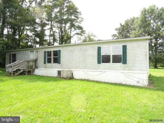 Large Double-wide on nice lot.  Double-wide needs totally redone from top to bottom.  Loads of potential.  Located between New Oxford & Gettysburg.  Wood deck off rear of property, open floor plan, master bedroom and bath.  Off street parking.