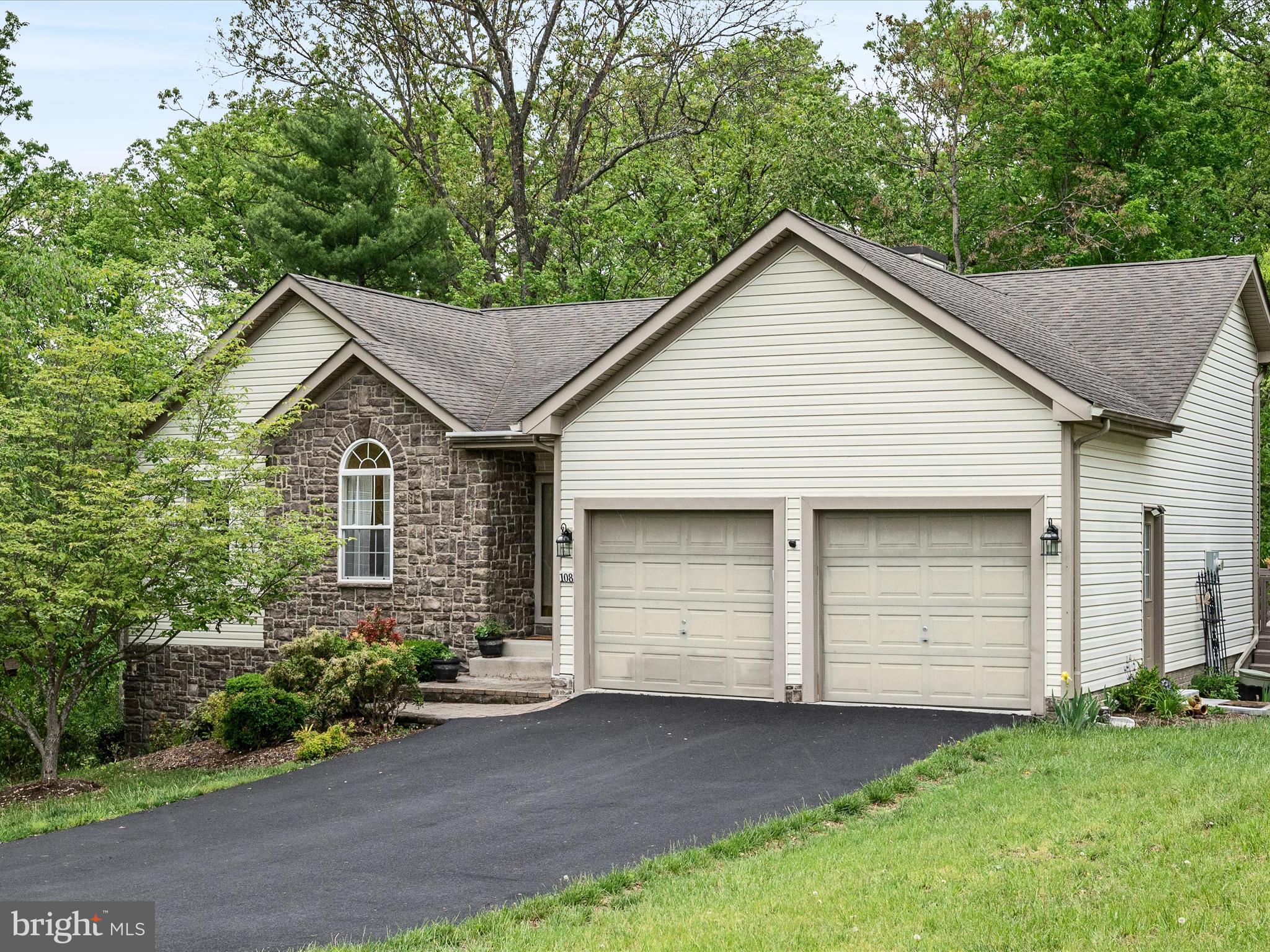 Nestled within a vibrant, gated lakeside community, this meticulously maintained ranch-style home located on a quiet road offers a harmonious blend of elegance and comfort. Designed for both relaxation and entertainment, the open-concept layout features vaulted ceilings that amplify the spacious ambiance. The well-appointed kitchen boasts stainless steel appliances, including a built-in microwave, ample counter space, and a convenient pantry. Adjacent to the kitchen, the dining area comfortably accommodates a large table, perfect for gatherings.  The inviting living room opens to a private deck, complete with a remote-controlled Sunsetter awning, offering serene views of the backyard where deer, birds, and other wildlife are often spotted. An office with a decorative radius window is located off the living room, featuring a closet, it can easily serve as a bedroom if desired.  The expansive owner's suite serves as a private retreat, featuring a tray ceiling and an ensuite bathroom including a jetted tub.  A laundry area is located on this level for easy one level living.  The fully finished walk-out basement extends the home's living space, featuring a kitchenette, a spacious fourth bedroom, a third full bath, and another laundry area making this space ideal for hosting guests or creating a private suite.  Residents of this lakeside community enjoy access to three private beaches, a dog park, and scenic walking and hiking trails. Whether you're seeking a peaceful retreat or an active lifestyle, this home offers the perfect blend of comfort and convenience.  **onsite mailbox**onsite Trash Connivence Center-available 24/7.  Come make your home at Lake Holiday Estates!