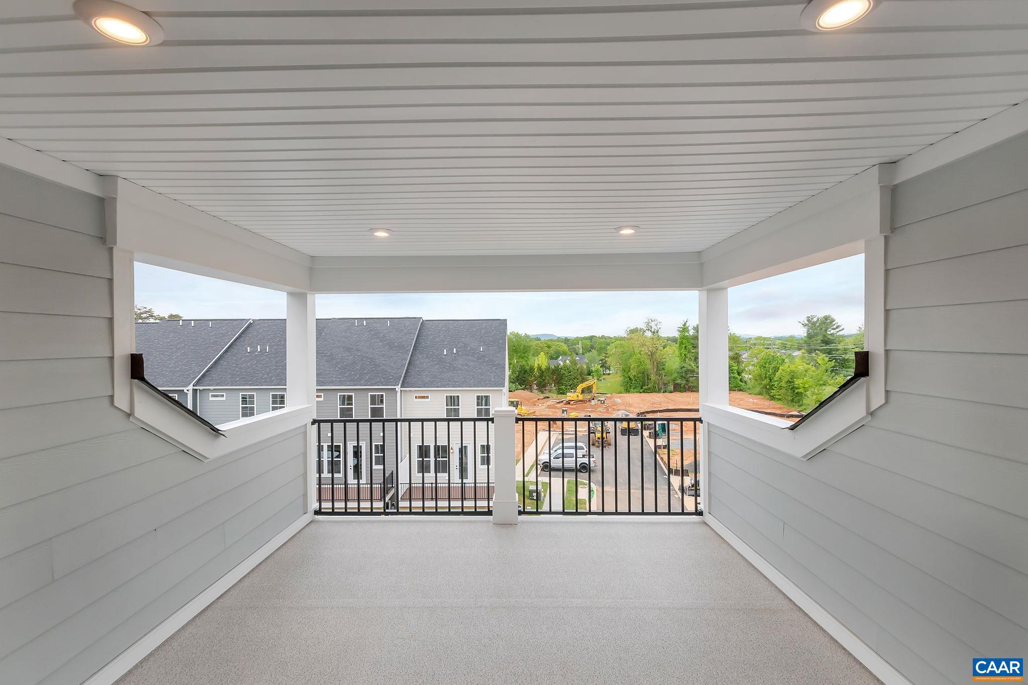 Under Construction with Oct. 2023 Delivery!  Enjoy gorgeous VIEWS from your 4th Level COVERED ROOFTOP TERRACE. Welcome to the Grove at Brookhill, a quiet NEW neighborhood nestled in the woods with all the conveniences of Route 29 North in Charlottesville. The Holly townhome is an effortlessly open plan with a spacious galley kitchen and INCLUDED maintenance-free DECK - perfect for an evening of entertaining friends and family. The ATTACHED 1-CAR GARAGE provides easy parking/storage.  Use the 1st FLOOR ENSUITE BEDROOM or 4th FLOOR LOFT/BONUS ROOM as an alternative home office, hobby, or exercise room. Unleash your originality as you work one-on-one with our designer to create spaces that works best for your aesthetic and budget - YOU control the final price. The Grove at Brookhill will offer parks, walking trails, mountain views, shopping, dining, tennis courts, gyms, and more. Reserve your favorite homesite today! Similar photos.,Granite Counter,Maple Cabinets,Painted Cabinets,White Cabinets