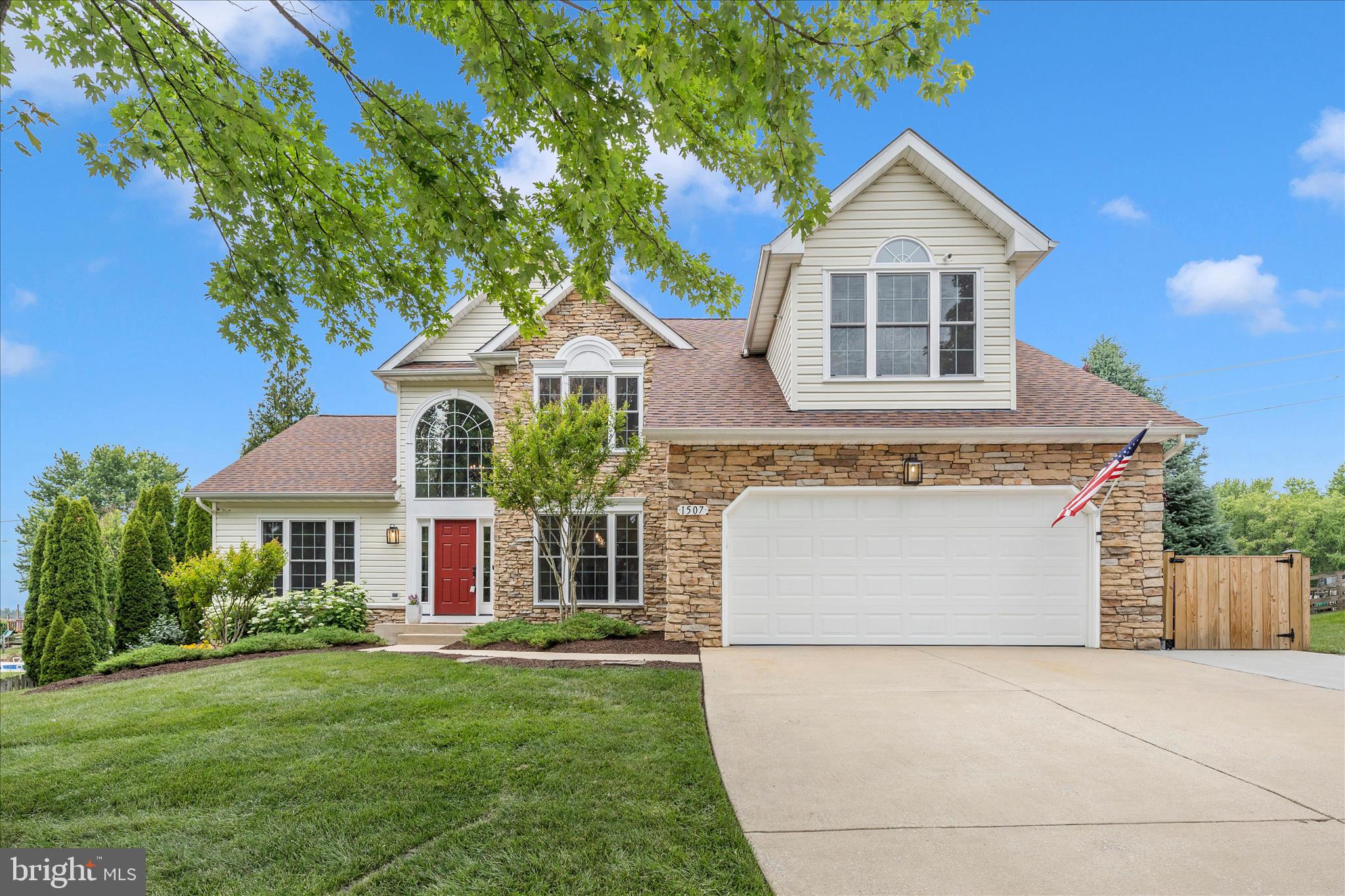 Welcome to this exceptional stone-front residence in the highly sought-after Summit Ridge community, where timeless elegance, thoughtful updates, and versatile living spaces come together to create a truly remarkable home. Offering 4 bedrooms, 4 full baths, 1 half bath, and 4,476 square feet of beautifully finished living space, this move-in-ready property features the rare advantage of two primary suites, including a true main-level primary retreat and a spacious second primary suite upstairs—ideal for multi-generational living or those seeking the convenience of main-level living without compromising space.
Inside, rich wood flooring flows throughout the main level, complemented by fresh finishes and an inviting open layout designed for both everyday living and entertaining. The recently renovated kitchen is a standout feature, showcasing white shaker cabinetry, quartz countertops, stainless steel appliances, and gas cooking. Just beyond, the dramatic family room is anchored by a cathedral ceiling and a stunning double-sided gas fireplace that seamlessly connects to the sunroom. Sliding glass doors provide easy access to the outdoor living spaces, creating the perfect indoor-outdoor flow.
The main-level primary suite offers a peaceful retreat with a vaulted ceiling, plush carpeting, a spacious closet with custom organization, and a luxurious renovated bath featuring a dual-sink vanity, oversized tiled shower, and linen closet.
Formal living and dining rooms provide elegant spaces for entertaining, hosting holiday gatherings, or creating a private home office. A convenient laundry room with additional storage and a powder room complete the main level.
Upstairs, new plush carpeting enhances the living spaces. The second primary suite is generously sized and features a vaulted ceiling, sitting area, walk-in closet, and spa-inspired en-suite bath with a dual-sink vanity, soaking tub, and separate shower. Two additional spacious bedrooms and a well-appointed hall bath provide comfortable accommodation for family and guests.
The expansive lower level is designed for entertaining on a grand scale, featuring a sprawling recreation room complete with a wet bar and beverage refrigerator. Multiple flexible spaces provide room for watching movies and sporting events, dining, game nights, billiards, or a sports table, creating the ultimate gathering space for family and friends.
Step outside and discover what truly sets this property apart. Situated on a beautifully landscaped and fully fenced 0.33-acre lot, the backyard has been thoughtfully transformed into a private outdoor oasis. A spacious deck overlooks an impressive outdoor living area featuring an expansive paver patio, outdoor fireplace, storage shed, and private basketball court. Mature landscaping and extensive hardscaping create a picturesque setting that perfectly balances recreation and relaxation. Whether hosting summer celebrations, gathering around the fire on cool evenings, or simply unwinding, this exceptional outdoor retreat offers a lifestyle rarely found.
This is a rare opportunity to own a beautifully updated home that combines luxury, flexibility, and outstanding indoor and outdoor living in one of the area's most desirable communities.