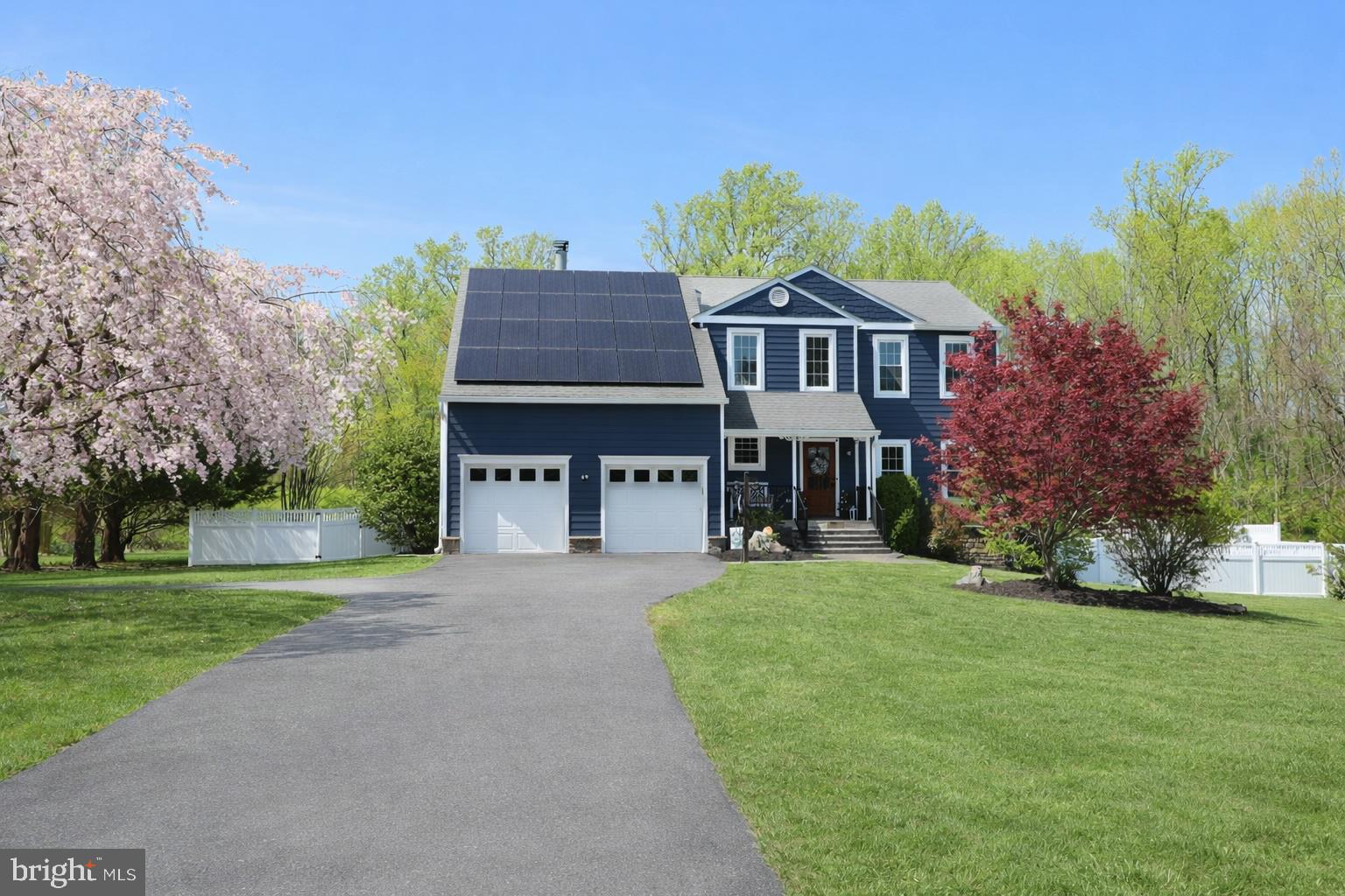 This exceptional 5-bedroom, 3.5-bath residence in sought-after Eagles Passages seamlessly blends luxury upgrades with everyday comfort, offering a true retreat-style living experience.

A wide driveway framed by blooming cherry blossoms welcomes you home, complemented by a paver walkway and inviting bluestone front porch. The backyard is designed for both relaxation and entertaining, featuring a Gunite pool (2022) with year-round climate control- capable of both heating and uniquely cooling the water- adjacent to a large stone paver patio with a built-in fire pit, a composite deck, and a fully cleared, level, and fenced yard backing to private wooded surroundings for an elevated sense of privacy in your ambiance filled entertaining space.

Inside, a dramatic two-story foyer sets the tone and leads into the fully reimagined kitchen (2023). This stunning space showcases custom cabinetry with soft-close drawers and tailored storage solutions, an expansive nearly 10-foot island, quartz countertops, a La Cornufe gas range with commercial-grade hood, a paneled Dacor refrigerator, and a wet/coffee bar complete with beverage fridge and Zip system offering hot, cold, and sparkling water.

Upstairs, the primary suite features vaulted ceilings and a beautifully appointed bathroom with dual vanities, a tiled shower with bench, and a spacious walk-in closet with a custom organization system. Three additional bedrooms, a full bath, and convenient upper-level laundry are connected by an open landing overlooking the foyer, allowing natural light to pour into the upper level.

The fully finished lower level offers a versatile walk-out recreation and fitness space with mat flooring for functional training, a fifth bedroom, and a beautifully upgraded full bathroom- ideal for guests or extended stays.

Additional highlights include a zoned HVAC (2024), a water treatment system (2024), two buried propane tanks (2022), Hunter Douglas motorized shades, electric vehicle charger, a Tesla powerwall back up charger that powers Sunrun solar panels, and newly added insulation in both the basement and attic for enhanced efficiency.

Residents enjoy access to community amenities including a pool, sport courts, pavilion, playground, and access to the South River with a pier and canoe/kayak launch.

Recent Updates: Crawl space and attic vapor barrier and new insulation (2025), HVAC replaced (2024), new water treatment system (2024), full kitchen renovation (2023), new washer and dryer (2023), and pool installed (2022).