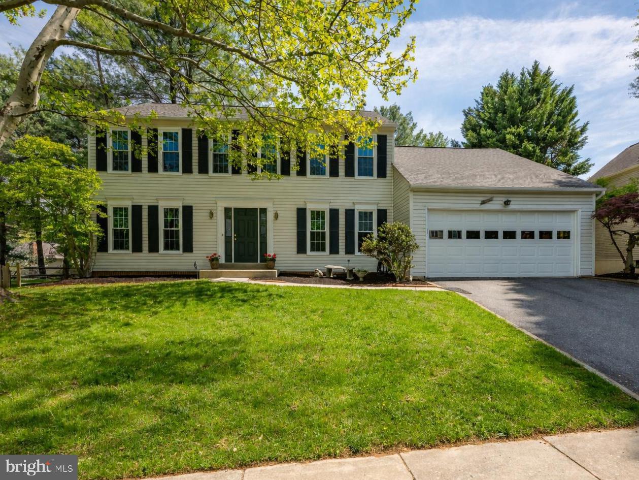 Located in the coveted Orchard Hills community, this classic 3,600 SF center hall Colonial offers timeless appeal, generous room sizes, and a setting that feels instantly like home.  Set on a quiet, tree-lined street - with sidewalks!- this home features a traditional floor plan with spacious Living and Dining Rooms, a comfortable Family Room with a fireplace, a main level study with built-ins and a vaulted ceiling, upgraded Chef's Kitchen with stainless steel appliances, granite countertops and a table space area leading to a large deck.  Upstairs well proportioned bedrooms include a Primary Suite with space to create a true retreat.  The gorgeous renovated Primary Bath offers a soaking tub and large stall shower plus double vanities.  Three other well-sized bedrooms and a hall full bath complete the upstairs.  The Lower Level has a cozy Recreation/Media Room with two walls of built-ins, a Game Table area, a "Bedroom," and a partially finished Exercise Room plus a big storage/laundry room.  The two car garage with an electric charger enters directly into the kitchen.  An easy run with groceries!  The private backyard and mature landscaping provide a peaceful backdrop.  Step outside to your private back deck- an inviting escape where you can unwind beneath a canopy of matures trees and let the stress of the day quietly fall away.  This beautifully treed cul-de-sac location is a rare offering in this established neighborhood.   Lovingly maintained, this home is in excellent condition.  Perfectly positioned for convenience, this home is moments from local schools, neighborhood shops, and dining, with easy access to Rio, Crown, the ICC-200 and I-270-bringing together neighborhood tranquility and effortless connectivity.  Make this beautiful home where your next chapter begins!